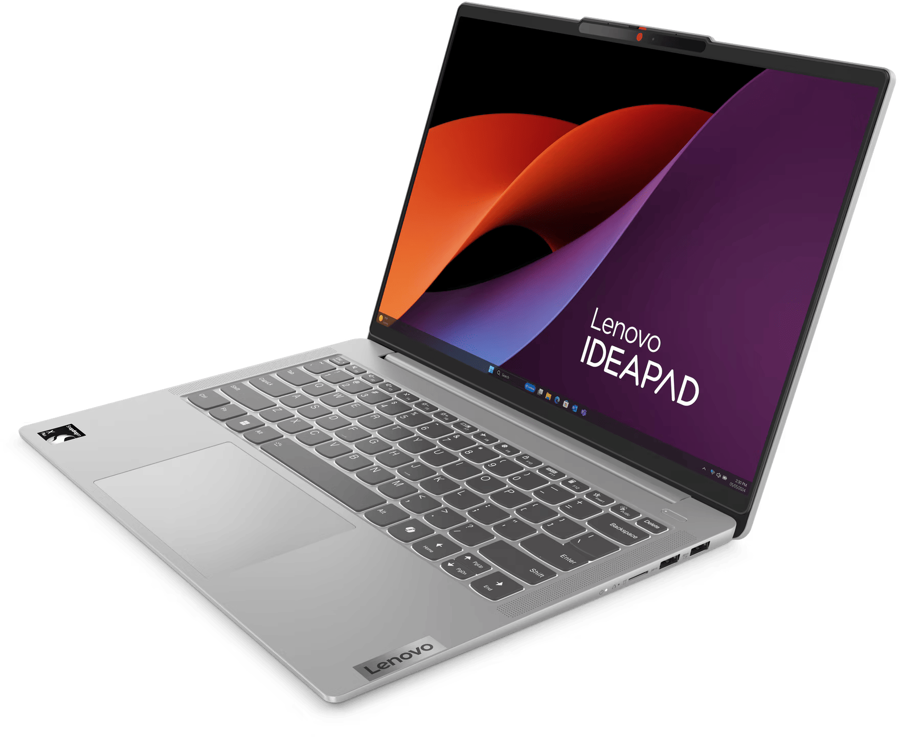 Egy ezüst laptop nyitva van, a Lenovo IDEAPAD logóval a képernyőn.