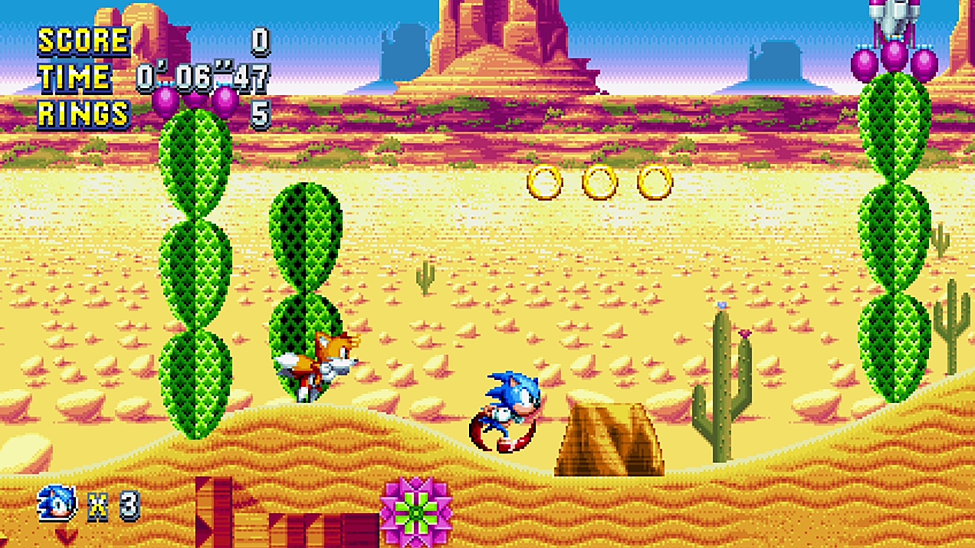 Una scena del gioco di Sonic. Sonic e Tails corrono in un ambiente desertico.
