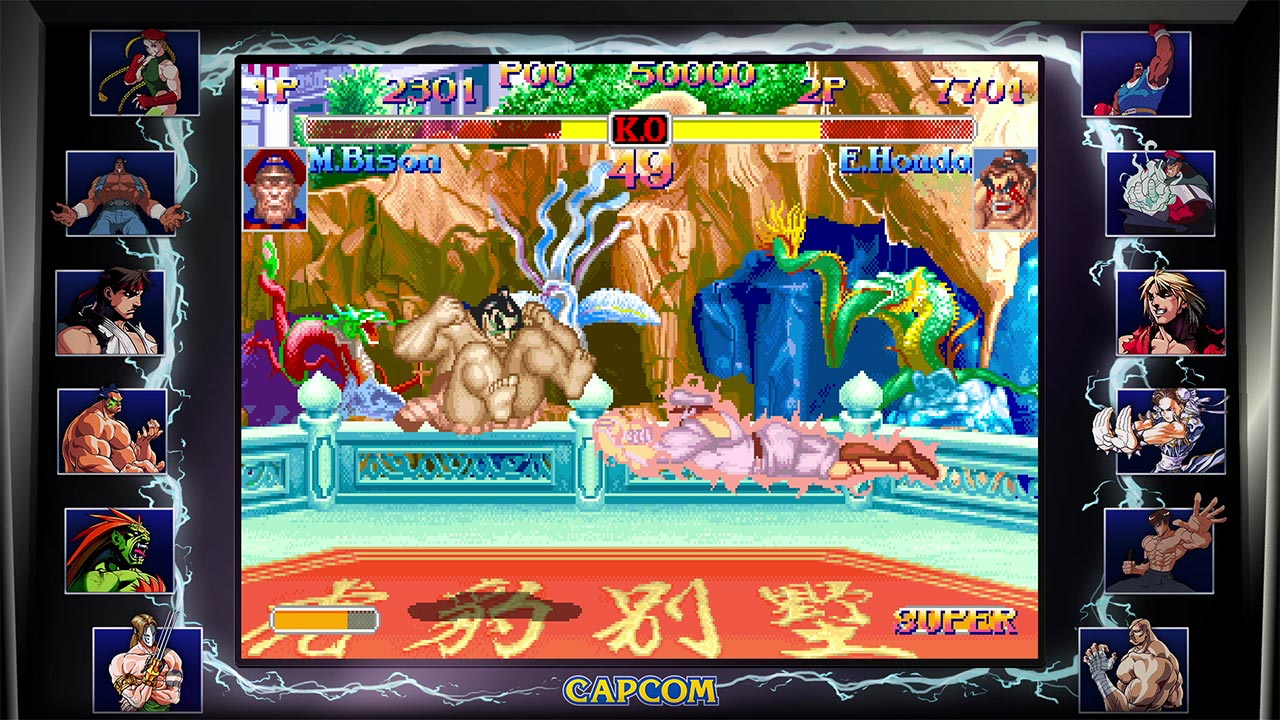 Scena di un gioco di combattimento con due personaggi. Uno è muscoloso, l'altro è a terra.
