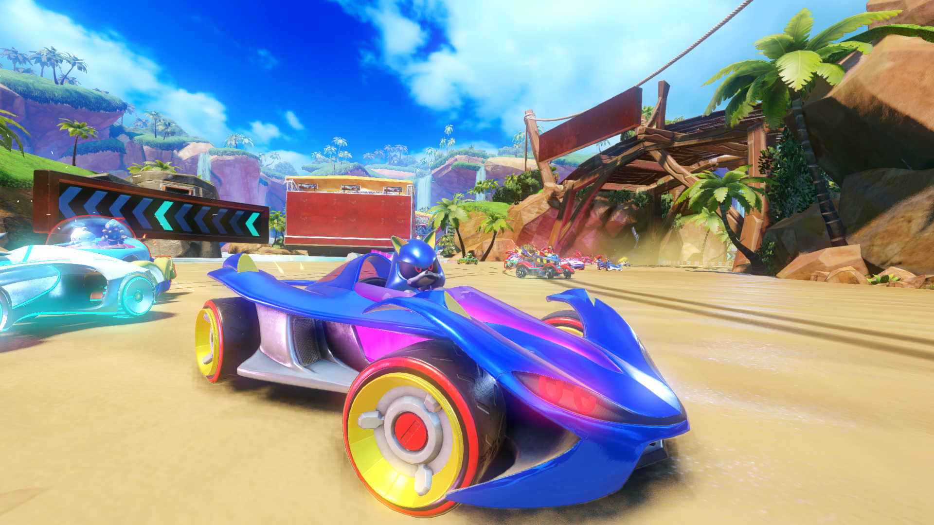 Voiture de course Sonic, bleue et rose, sur une piste avec d'autres voitures, fond ensoleillé.