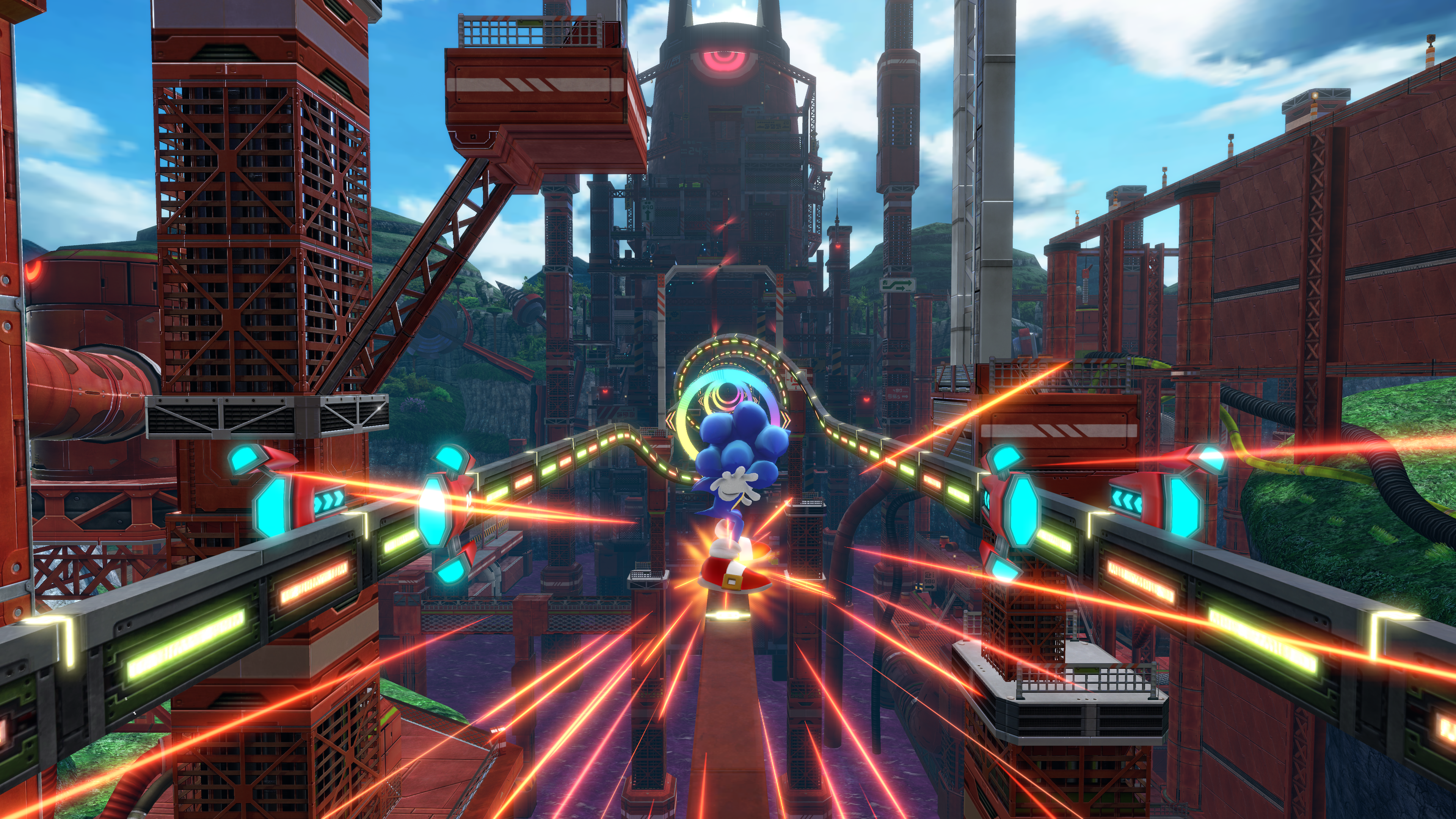 Una scena di videogioco con Sonic che corre su una pista in un ambiente urbano futuristico.
