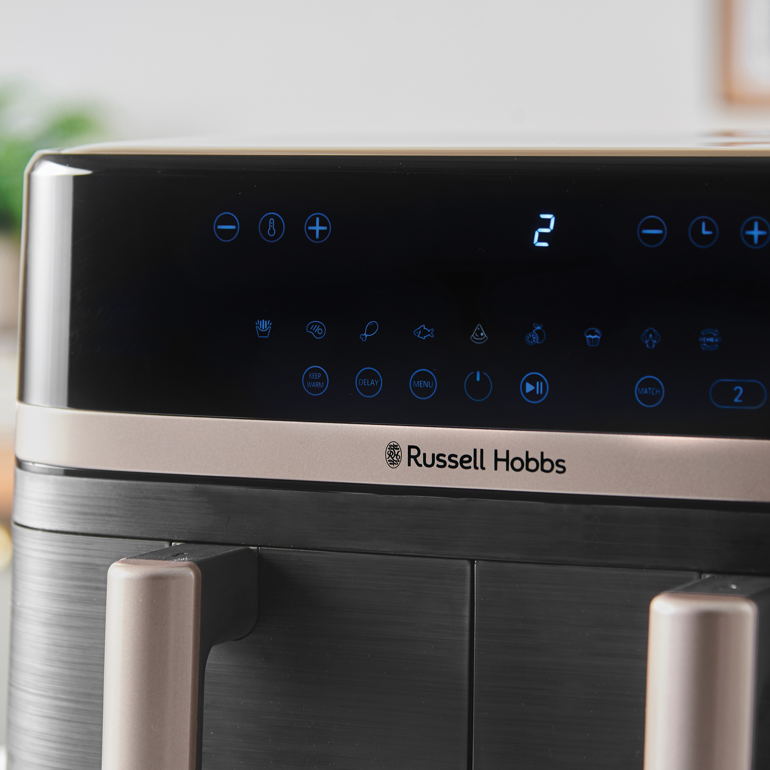 Close-up of air fryer control panel with Russell Hobbs logo.