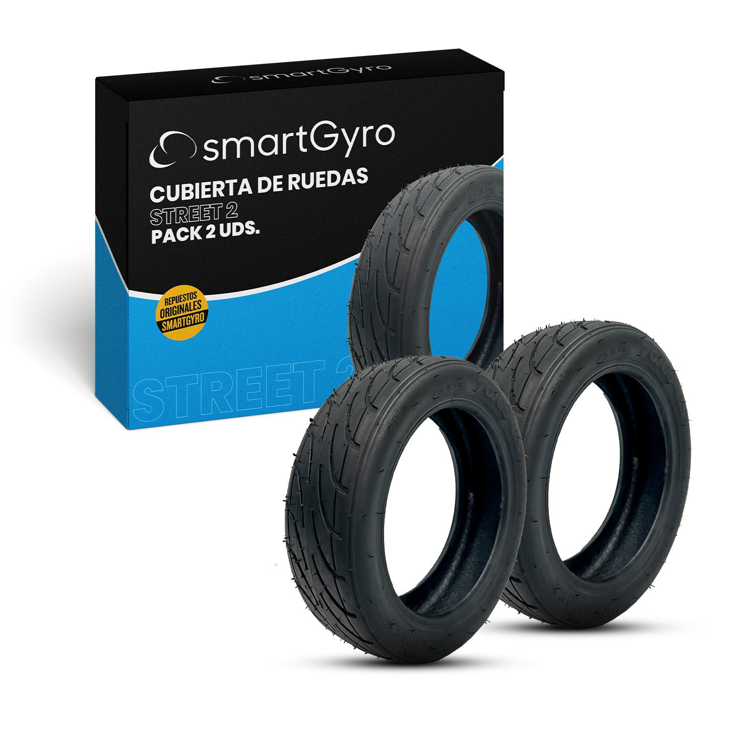 Caja con tres neumáticos negros para scooter. Texto en la caja: 'smartGyro' y 'STREET 2'.