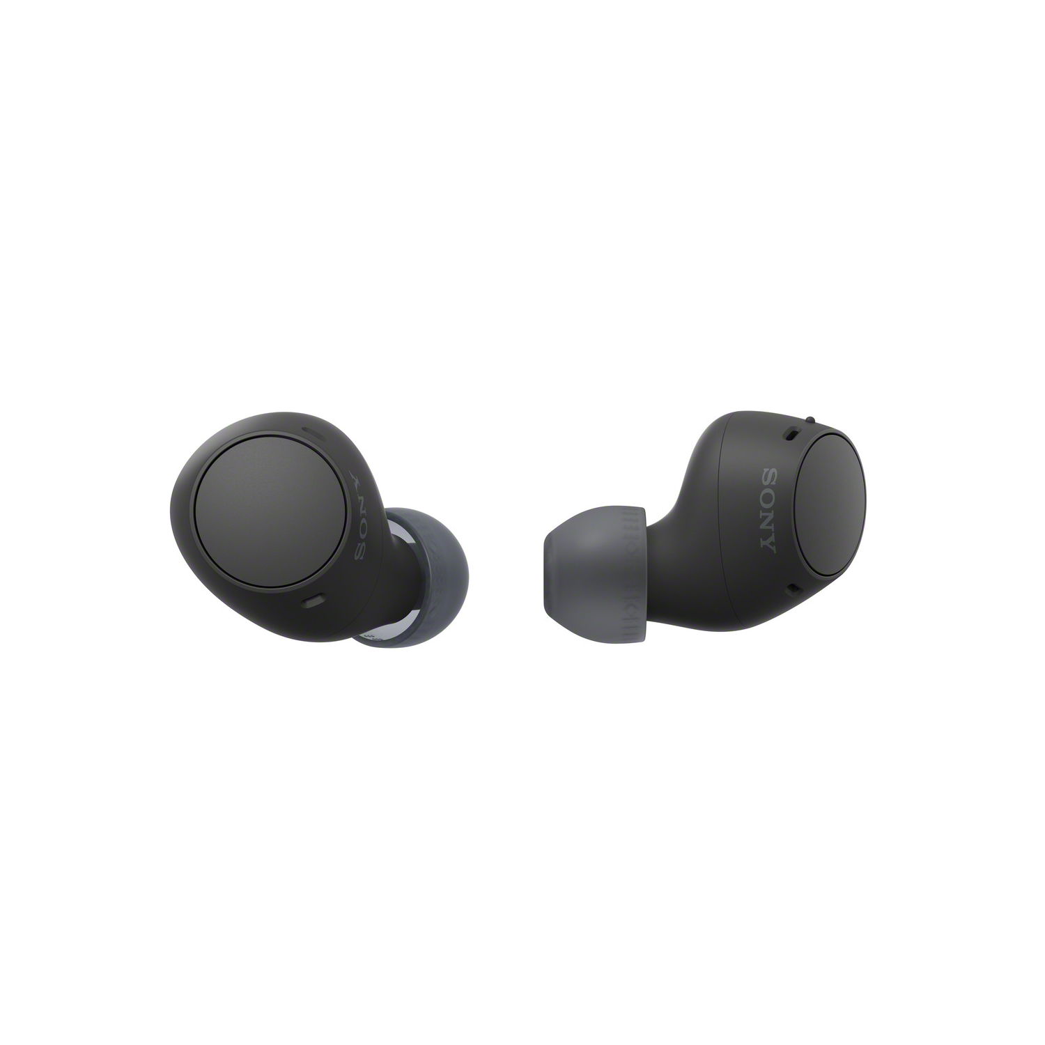 Black Sony earbuds, close up view. Two earbuds are visible. Grey ear tips.