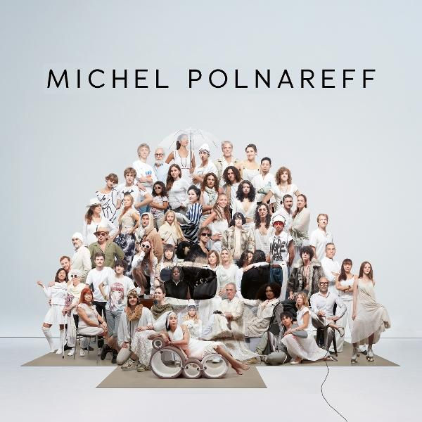 Un grand groupe de personnes d'âges et d'ethnies variés. Texte : Michel Polnareff.