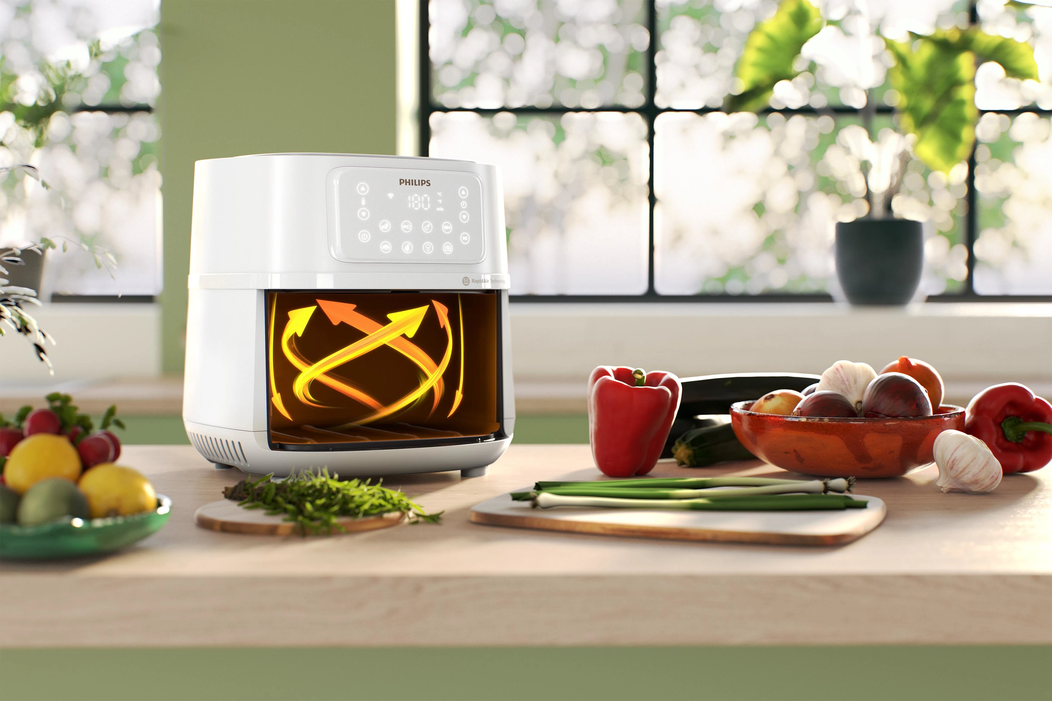 Biała frytkownica powietrzna z jedzeniem w środku. Warzywa i deski do krojenia na blacie kuchennym.