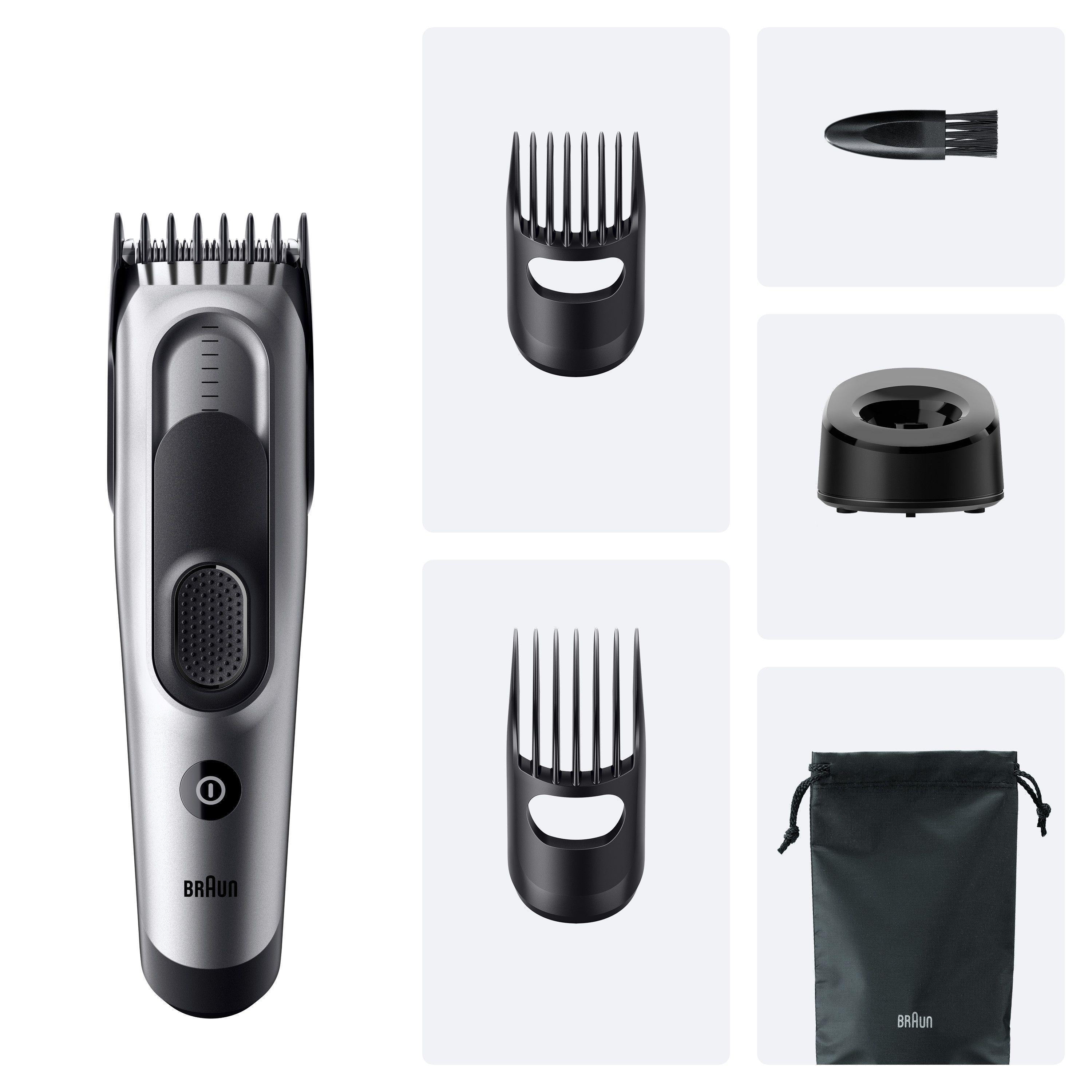 Silberner und schwarzer Braun Haarschneider mit Zubehör, einschließlich zwei Kämmen, einer Tasche und einem Ladegerät.