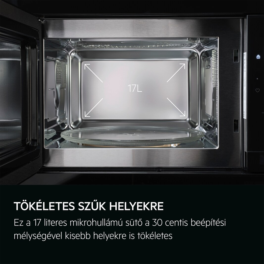 Nyitott mikrohullámú sütő belseje üveglappal és magyar nyelvű szöveggel.