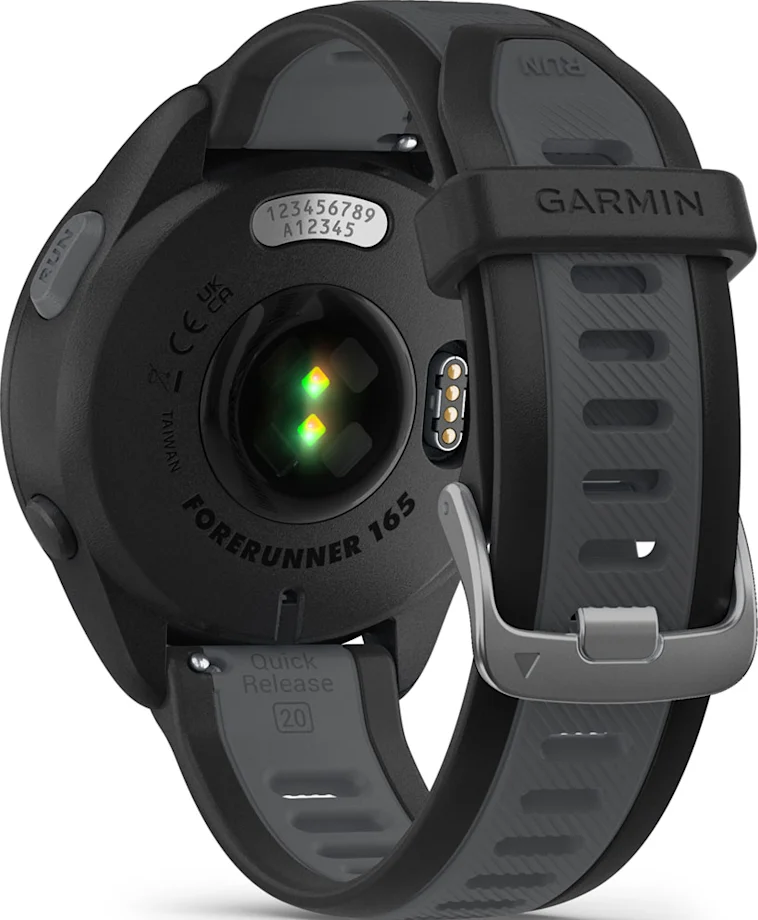 Montre Garmin noire, vue arrière, détails incluant le capteur de fréquence cardiaque et le bracelet.