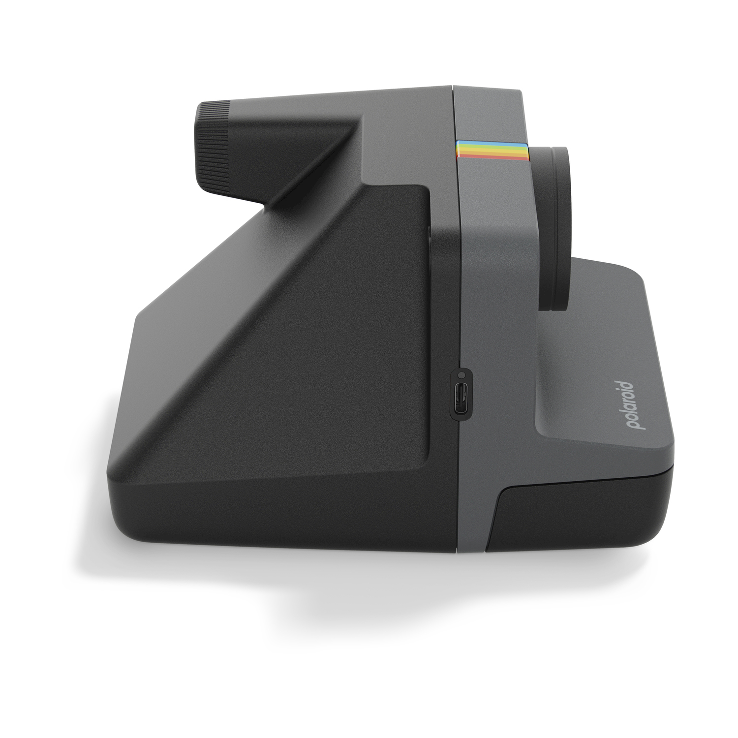 Fotocamera Polaroid, corpo grigio scuro, vista laterale, con una striscia arcobaleno e il marchio.