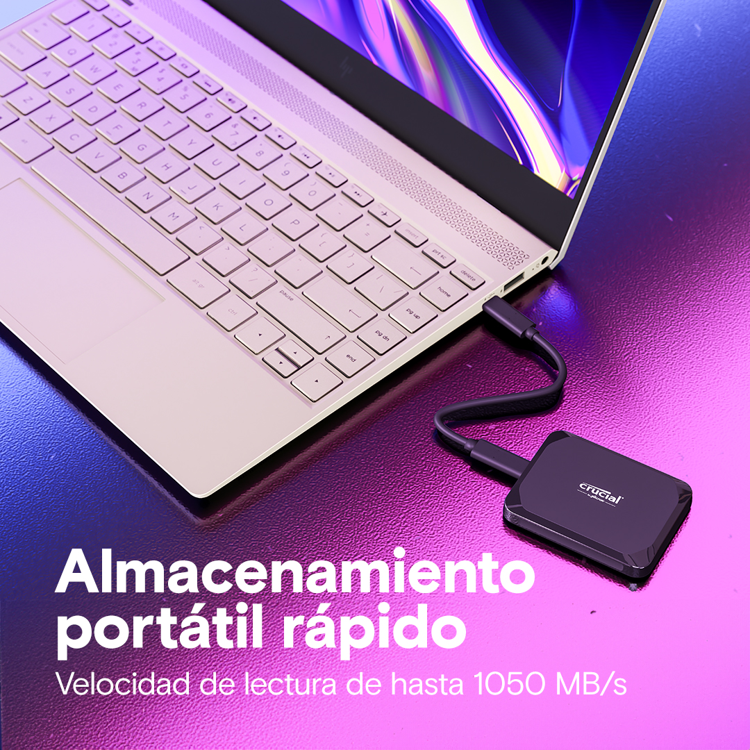 Portátil conectado a un disco duro externo. Texto: 'Almacenamiento portatil rapido' y 'Velocidad de lectura de hasta 1050 MB/s'.