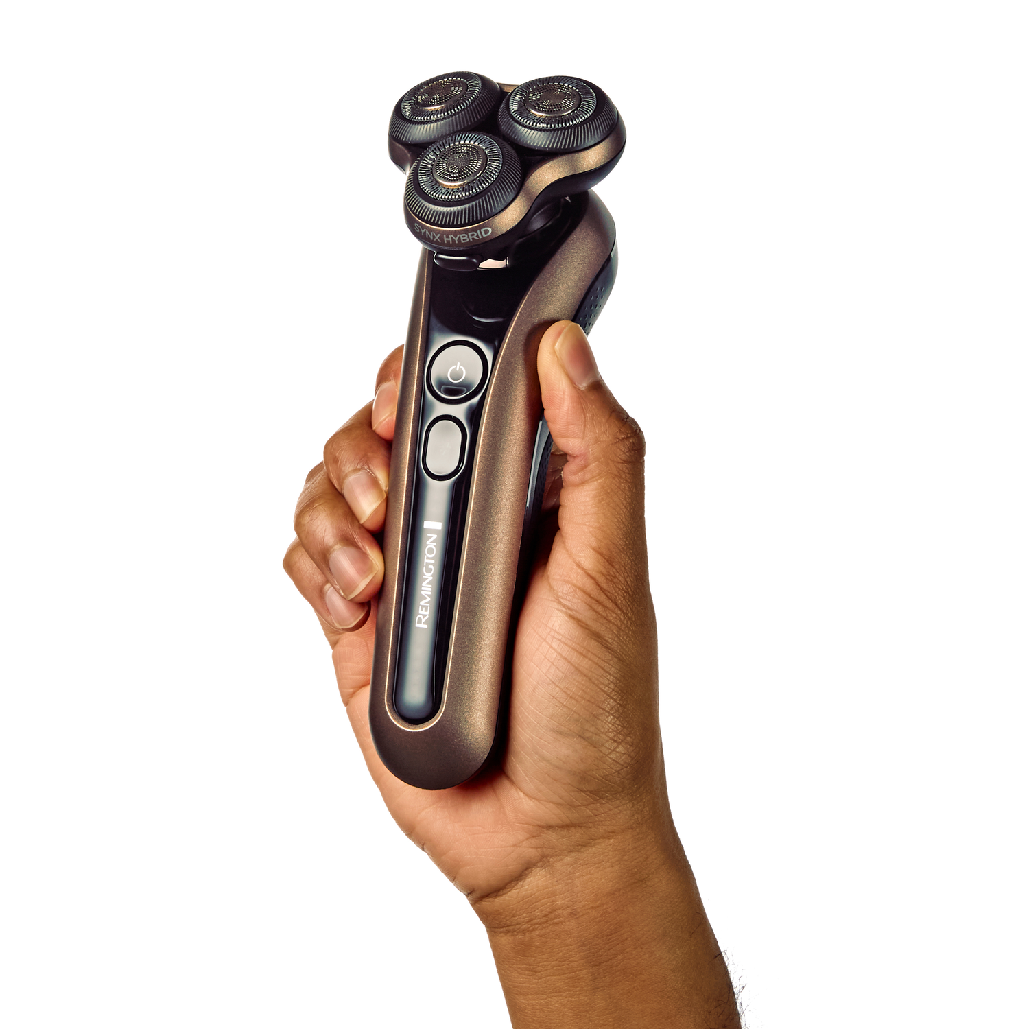 A person's hand holding a brown and black shaver. Power button is on the handle.