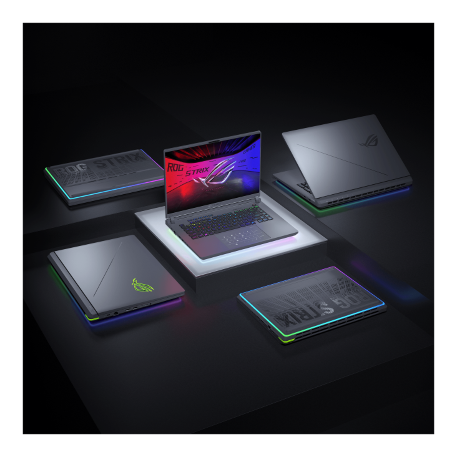 Multiple laptops on a black surface, lit with neon lights, are shown.