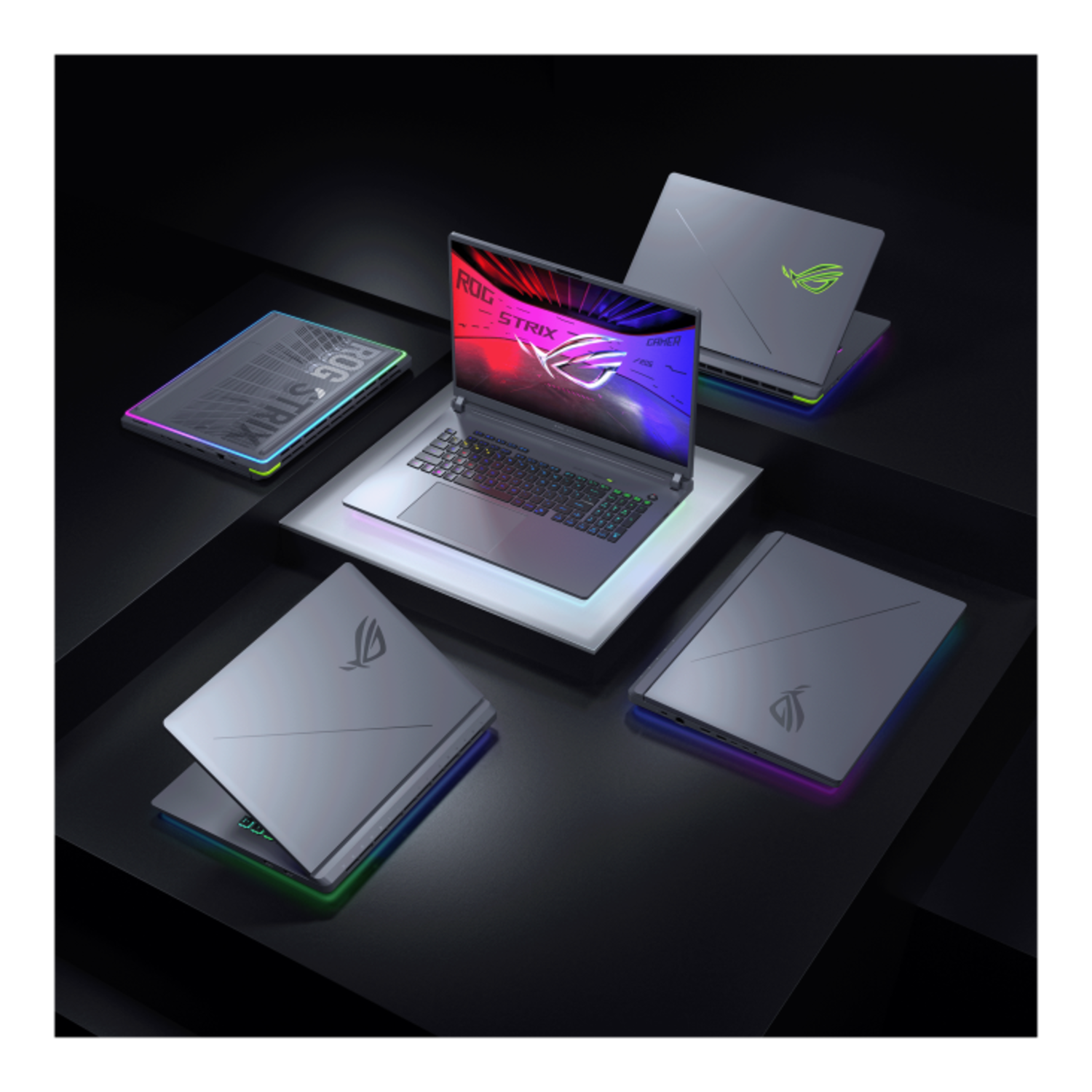 Multiple laptops on a black surface, some open.