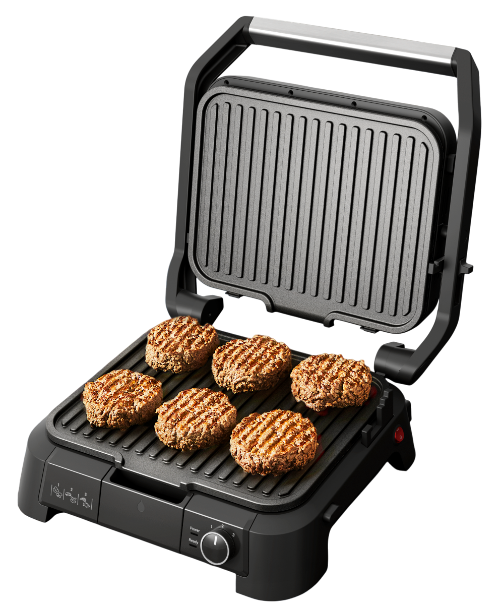 Ein offener schwarzer Grill mit sechs gekochten Hamburger-Patties.