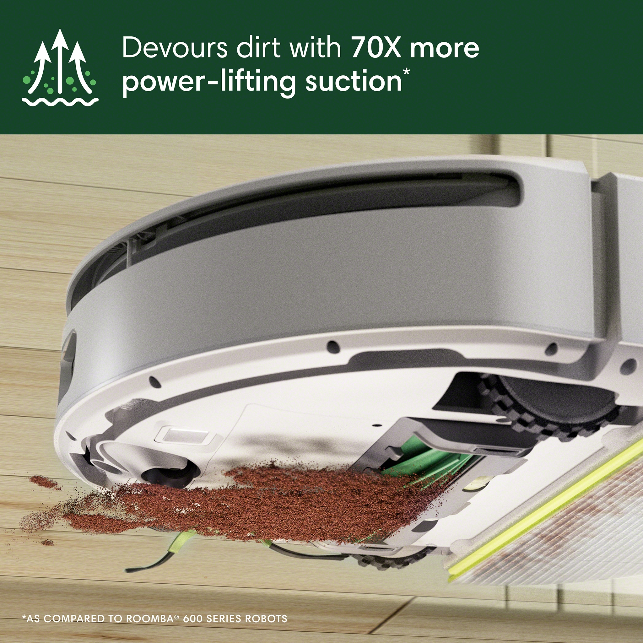 Aspirateur robot nettoyant un sol en bois, avec de la saleté et une brosse verte visibles.