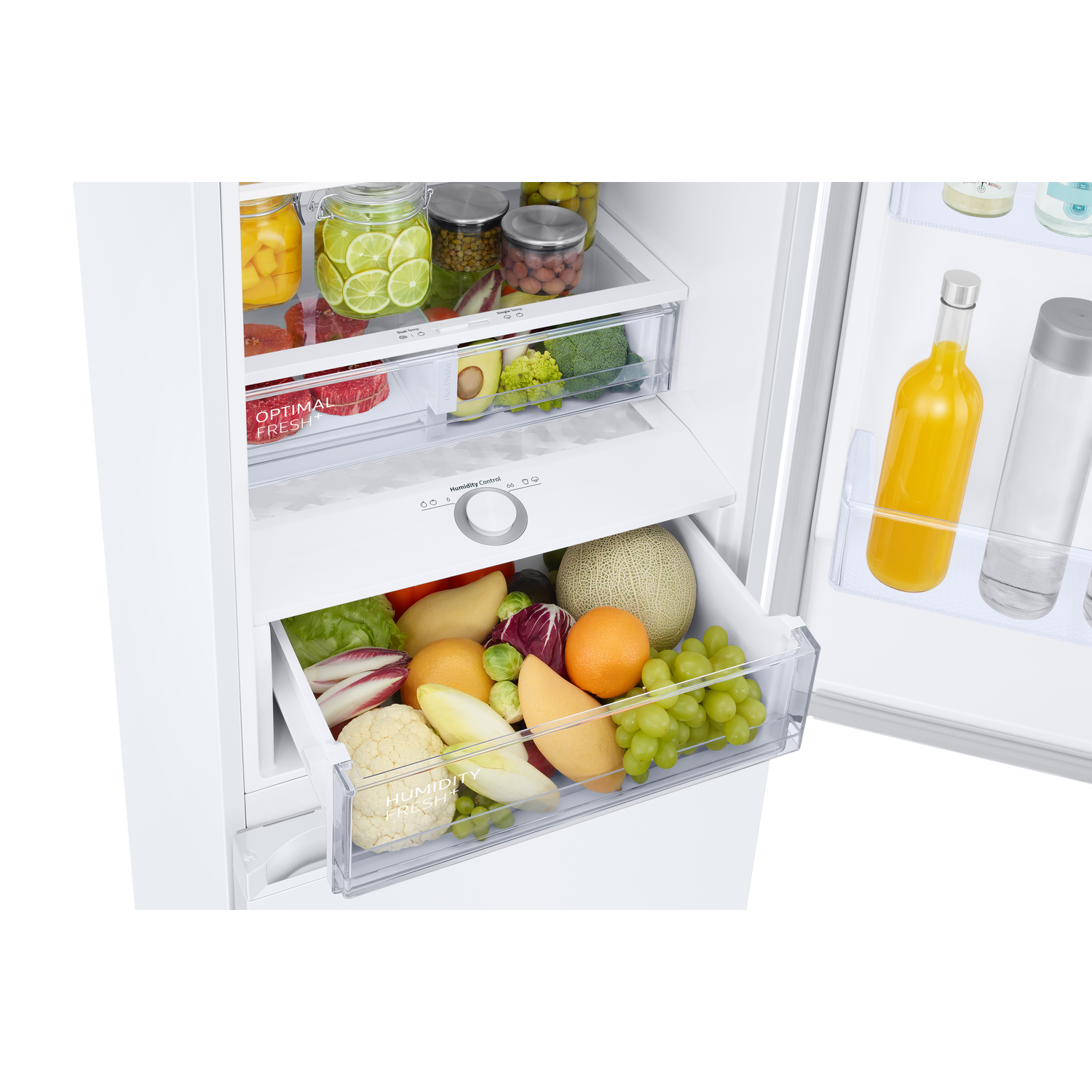 Refrigerator interior showing fresh produce in drawers: fruits, vegetables, and jars of food.