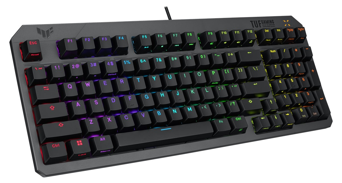 Renkli tuş ışıklarına sahip siyah bir klavye, sol üst köşede TUF GAMING logosu.