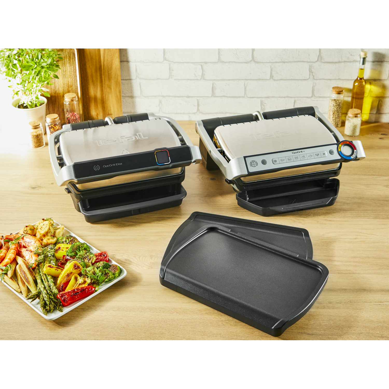 Two Tefal OptiGrill Elite grills with food.