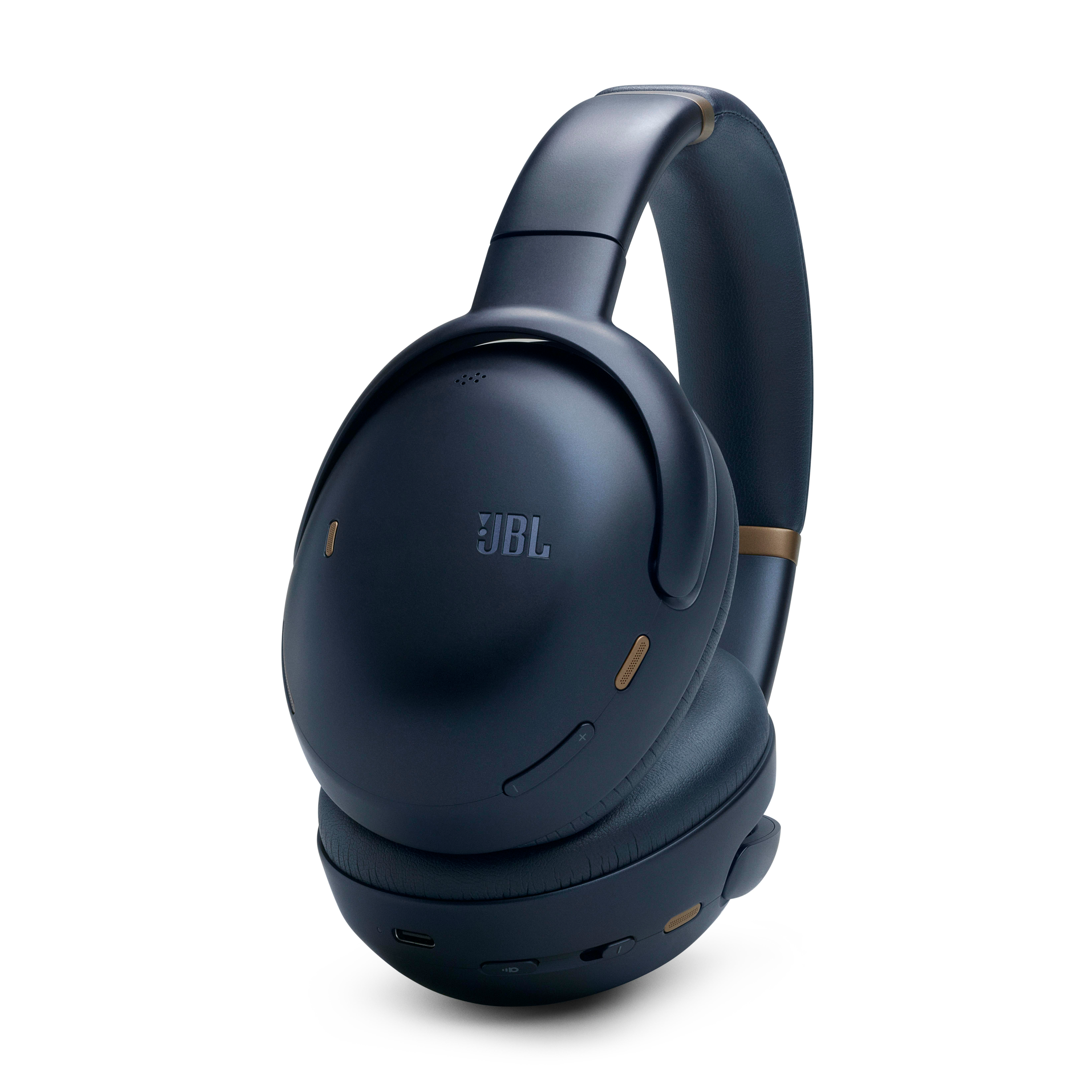 Dunkelblaue JBL Kopfhörer. Die Ohrmuscheln sind Over-Ear, mit goldenem JBL Logo.
