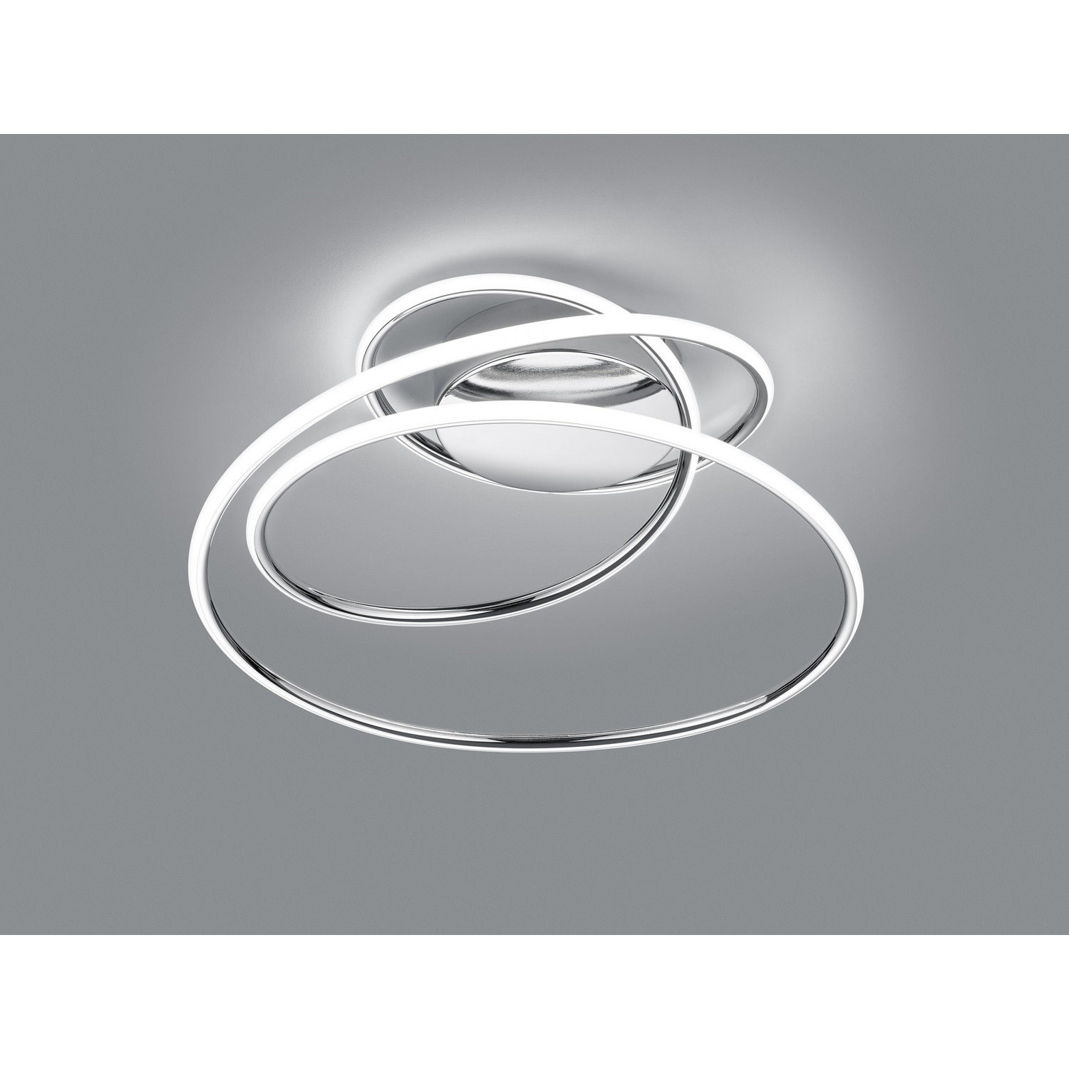 Lampada da soffitto argento e bianca con design a spirale. Un apparecchio moderno ed elegante.