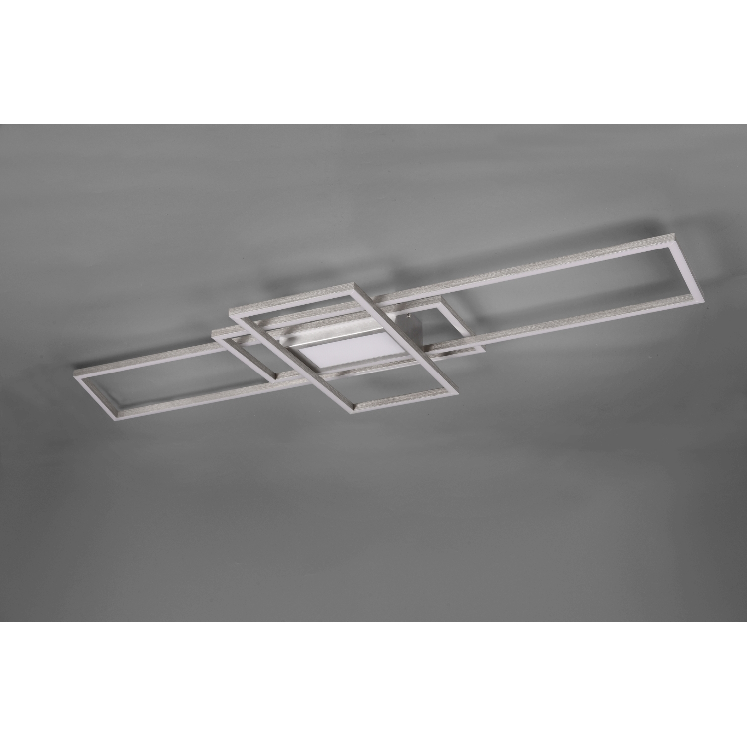 Lampada da soffitto moderna con design astratto, su sfondo grigio.