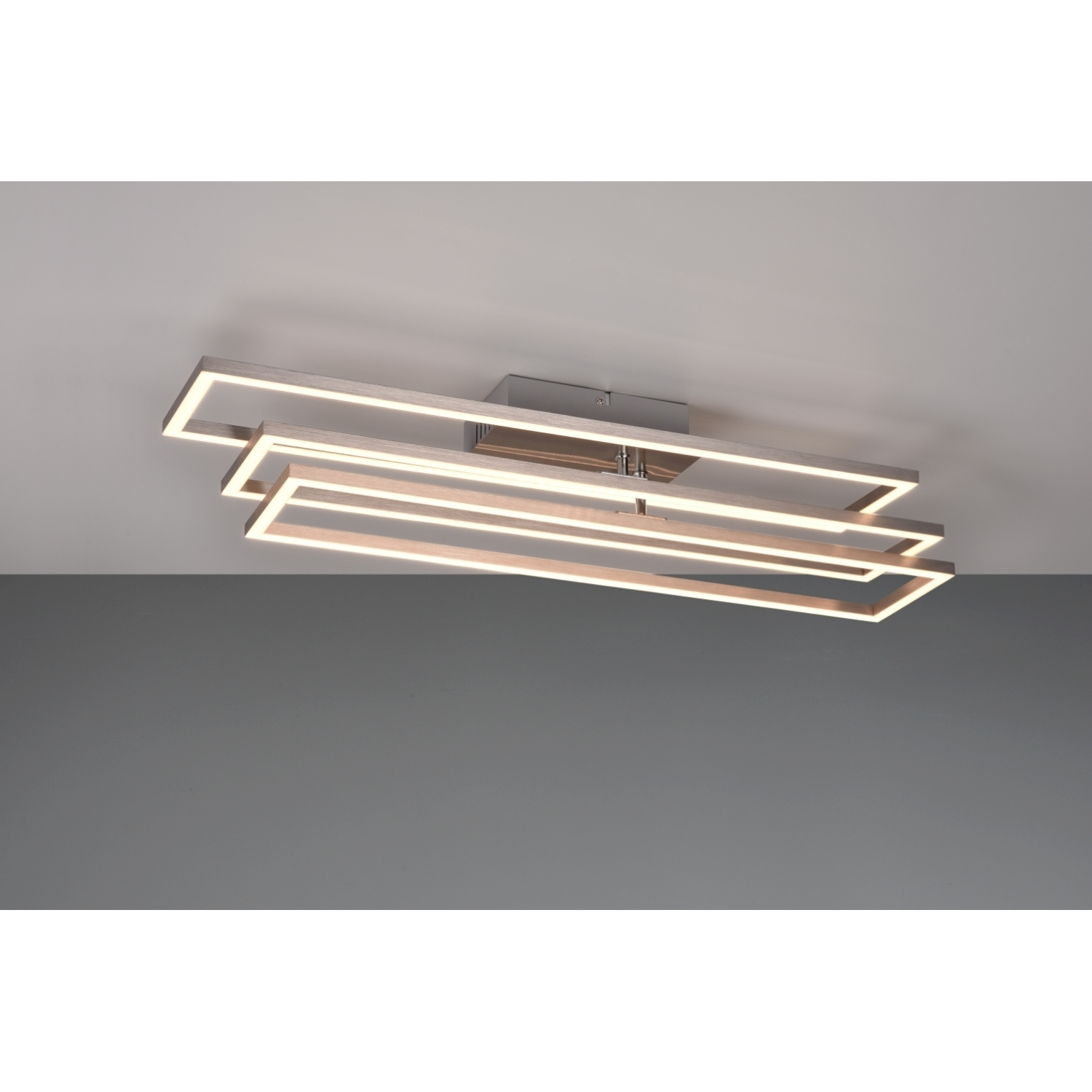 Lampada da soffitto moderna, forma rettangolare con luce. Sfondo grigio.