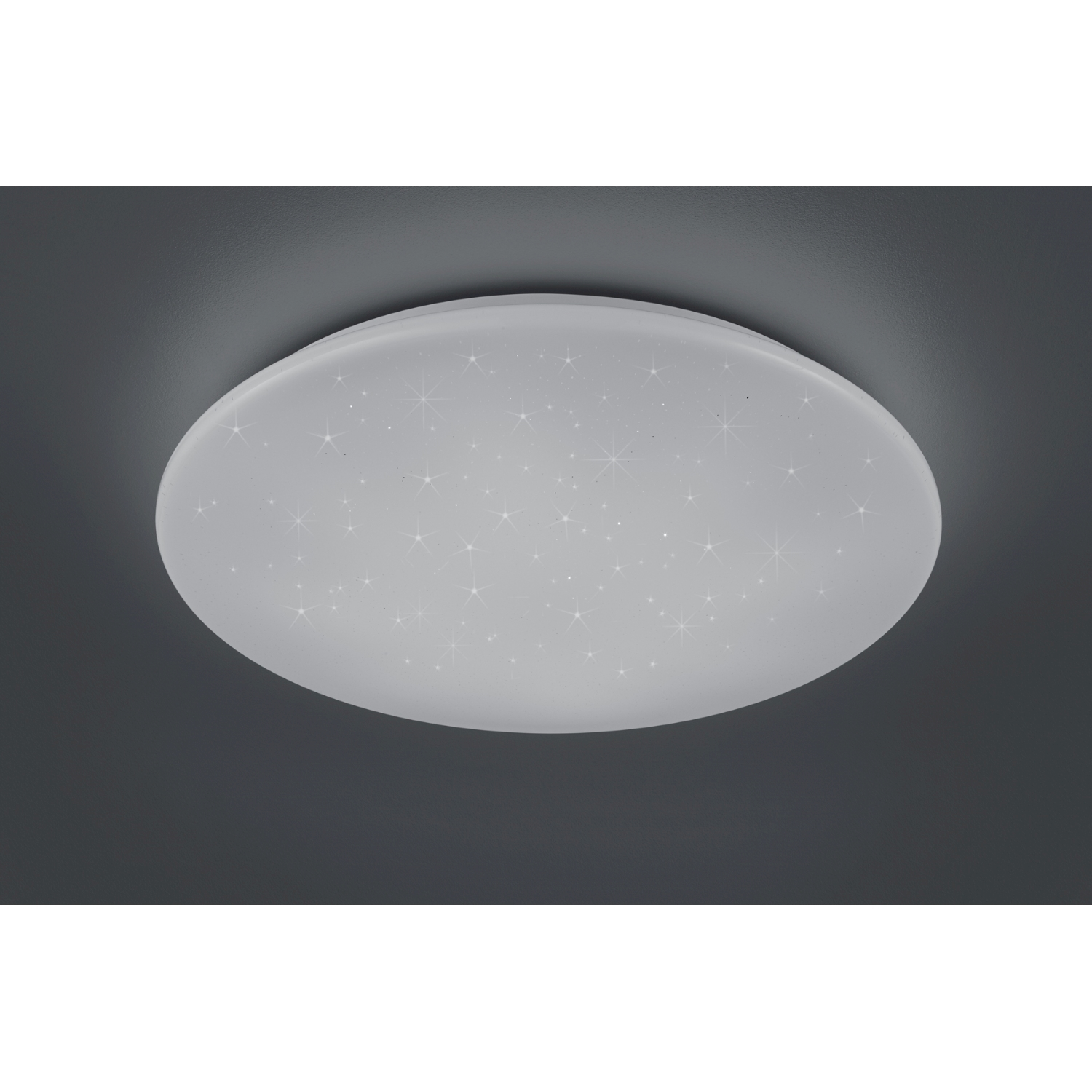 Una lampada da soffitto bianca, ovale, con luci a forma di stella su uno sfondo grigio scuro.