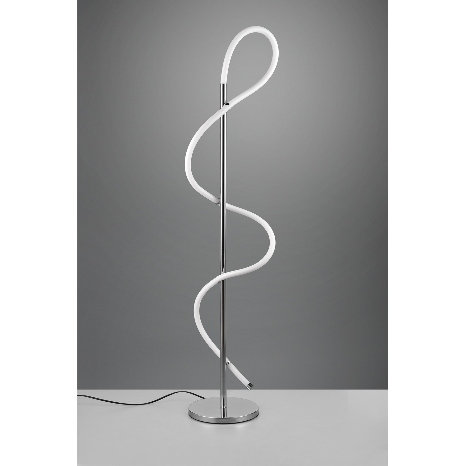Lampada da terra a spirale moderna con tubo luminoso bianco e base argentata.
