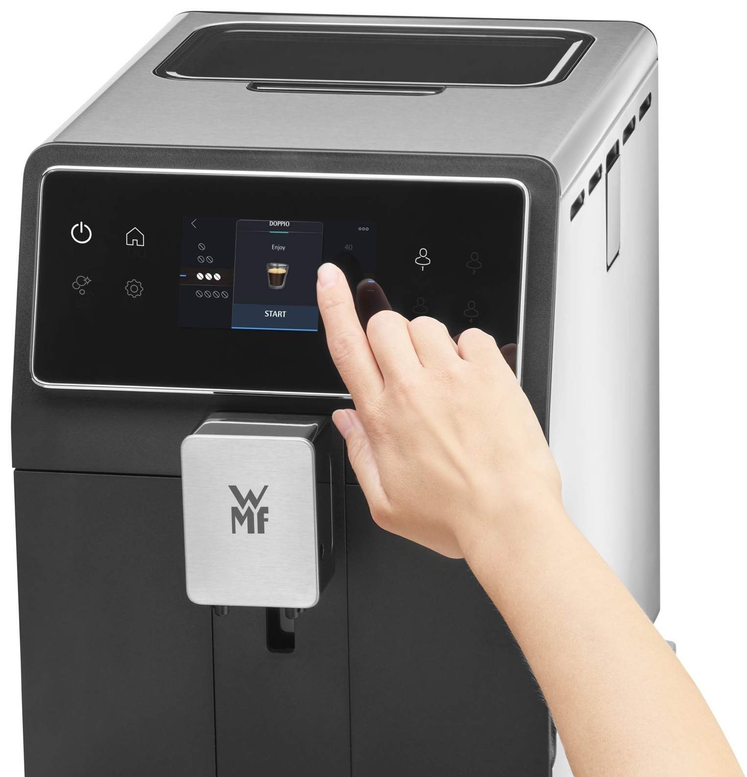 Ręka osoby wybiera przycisk 'START' na czarno-srebrnym ekspresie do kawy.
