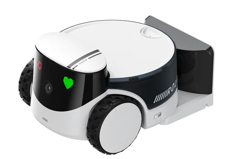 Biało-czarny robot z kołami. Z przodu ma zielone światło w kształcie serca.