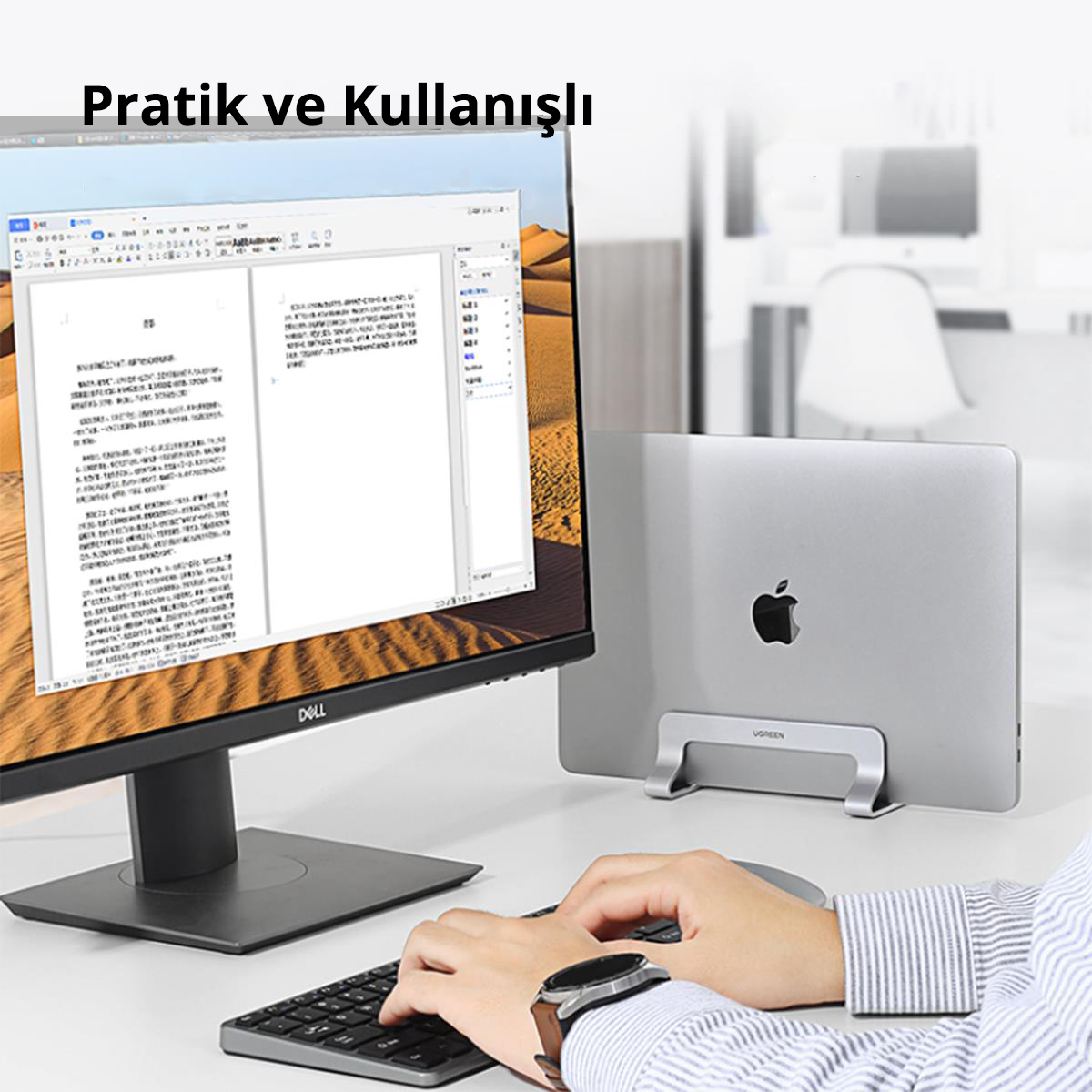 Bir kişi masada dizüstü bilgisayar kullanıyor.