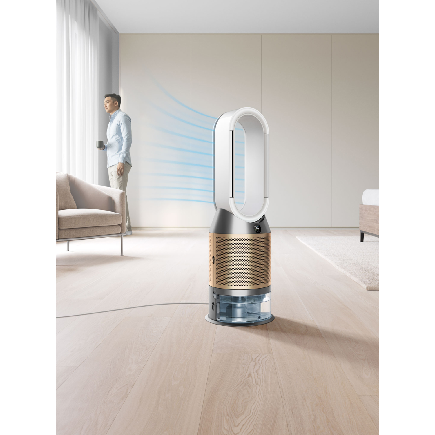A white and gold air purifier in a room. A man looks out the window. Blue air flows from the device.