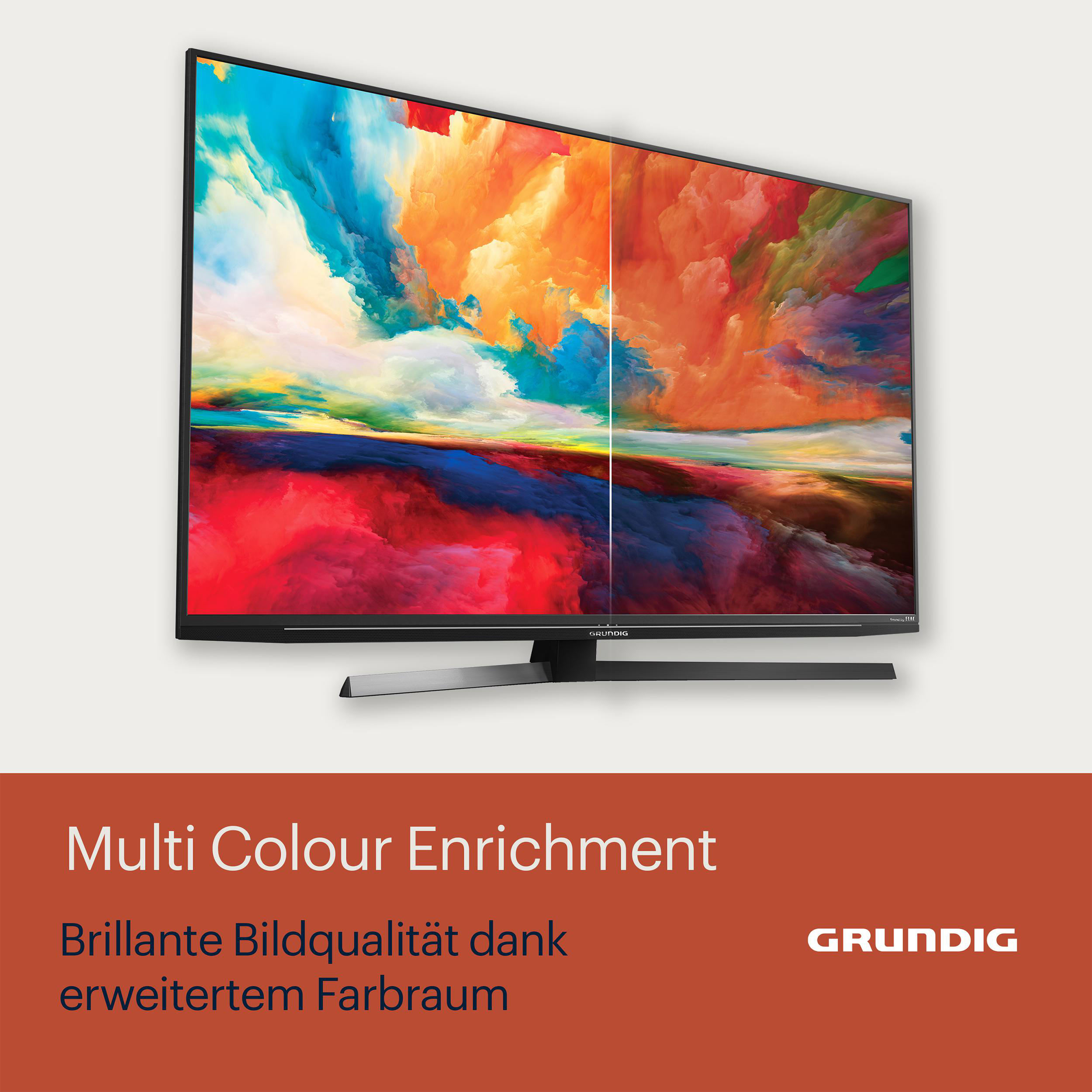 Ein Grundig-Fernseher, der ein farbenfrohes, abstraktes Bild anzeigt.
