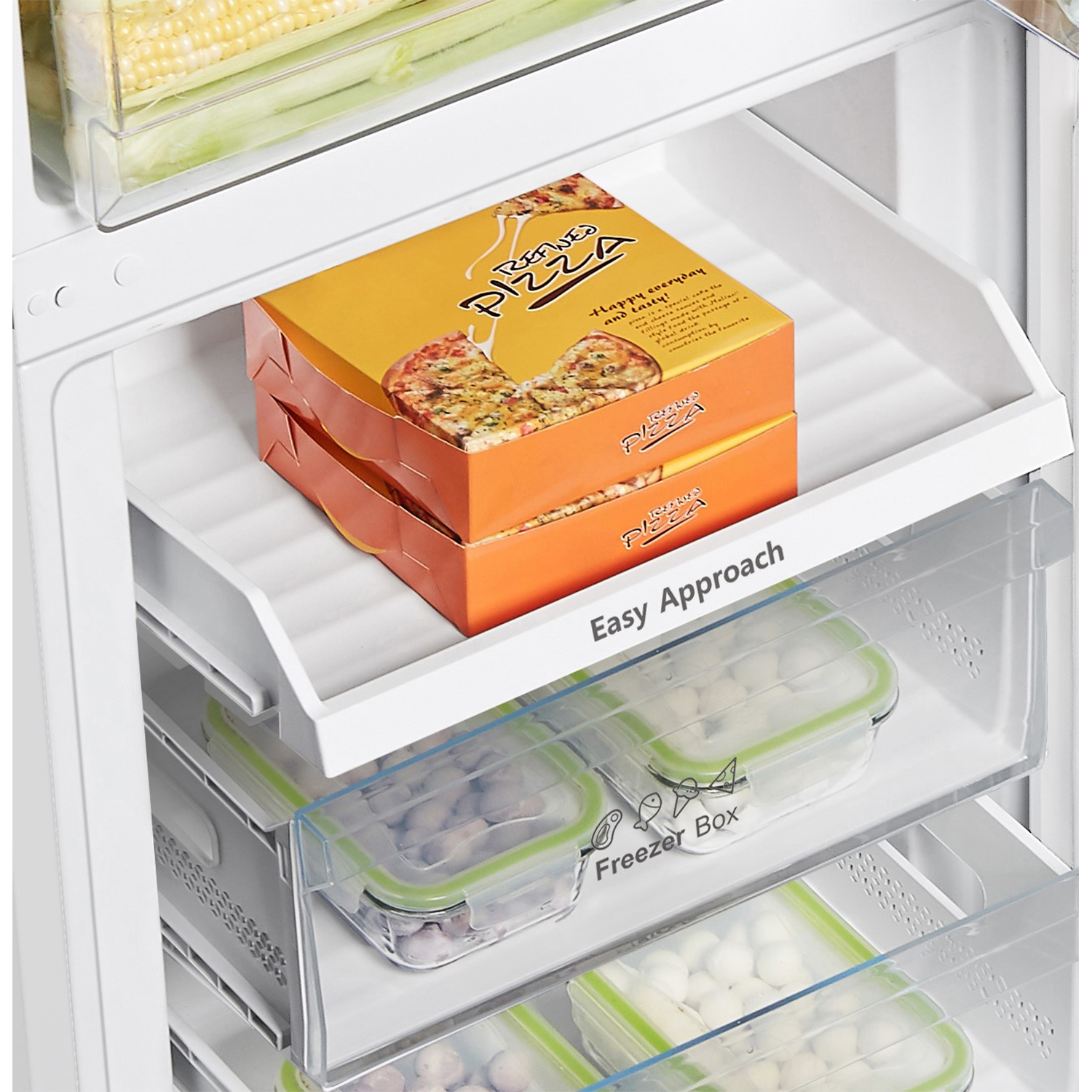 A refrigerator's Easy Approach tray with pizza boxes.