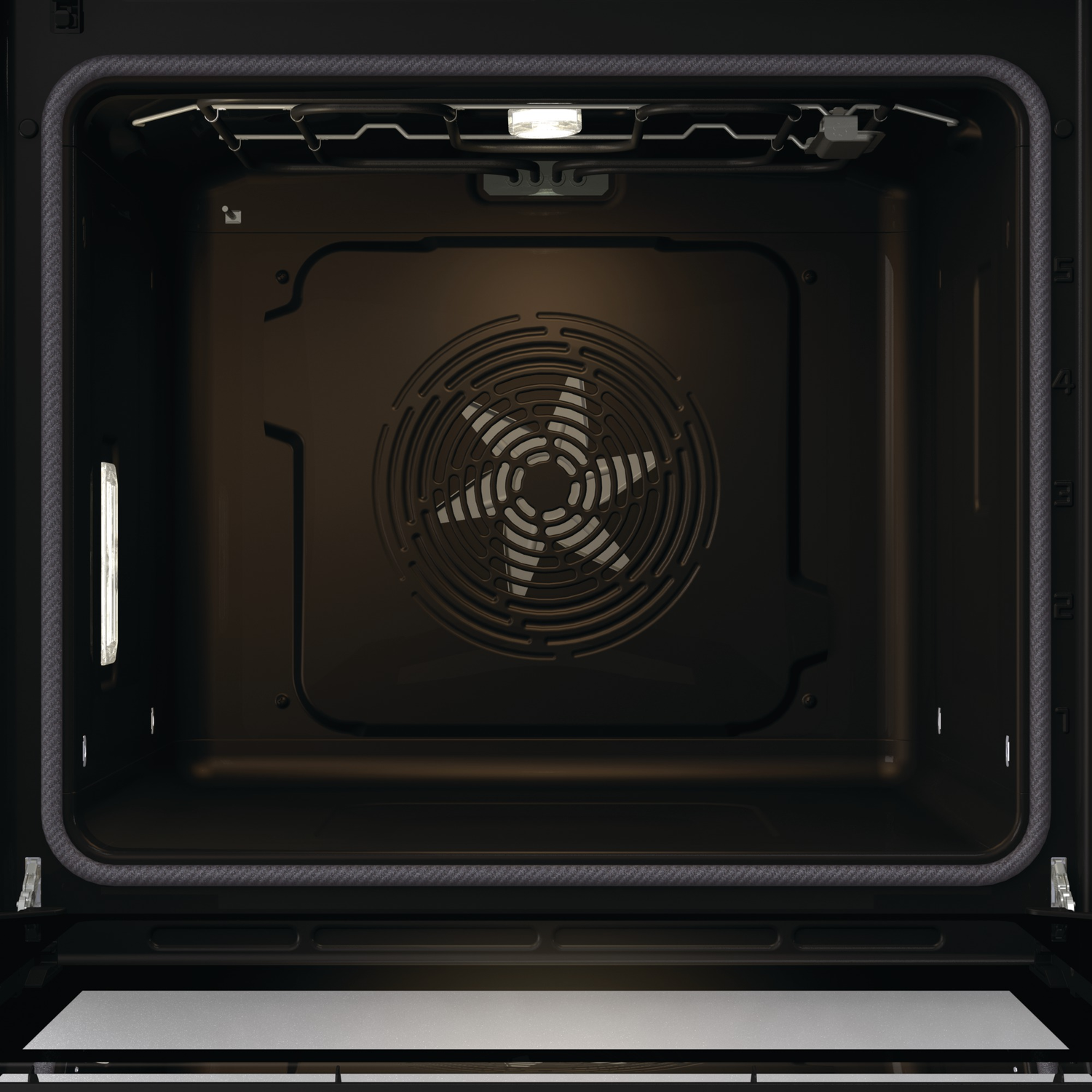 Inside view of an oven. A fan is in the center, surrounded by dark walls. A light is at the top. A metal rack is visible.