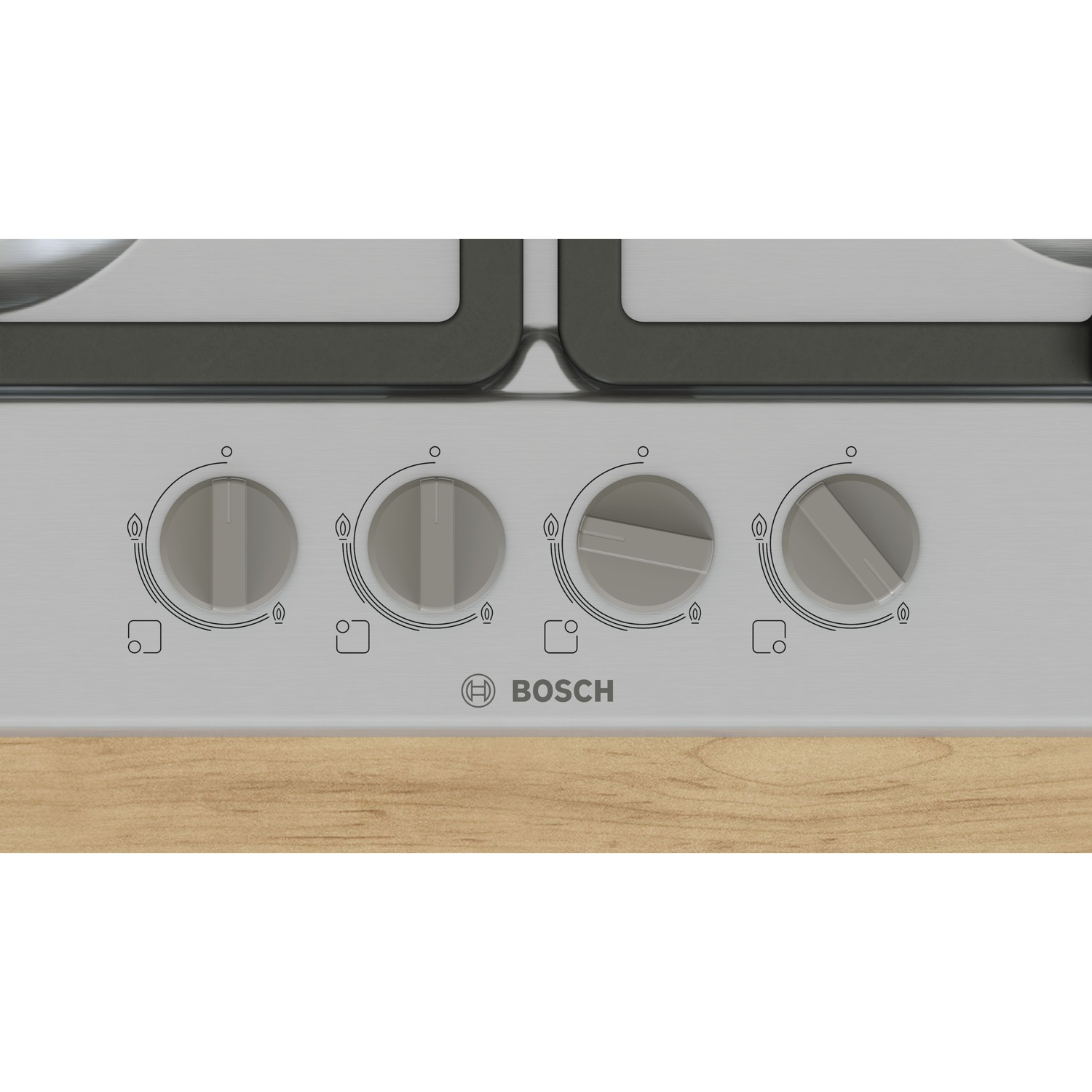 Primo piano di un piano cottura con quattro manopole e logo Bosch.