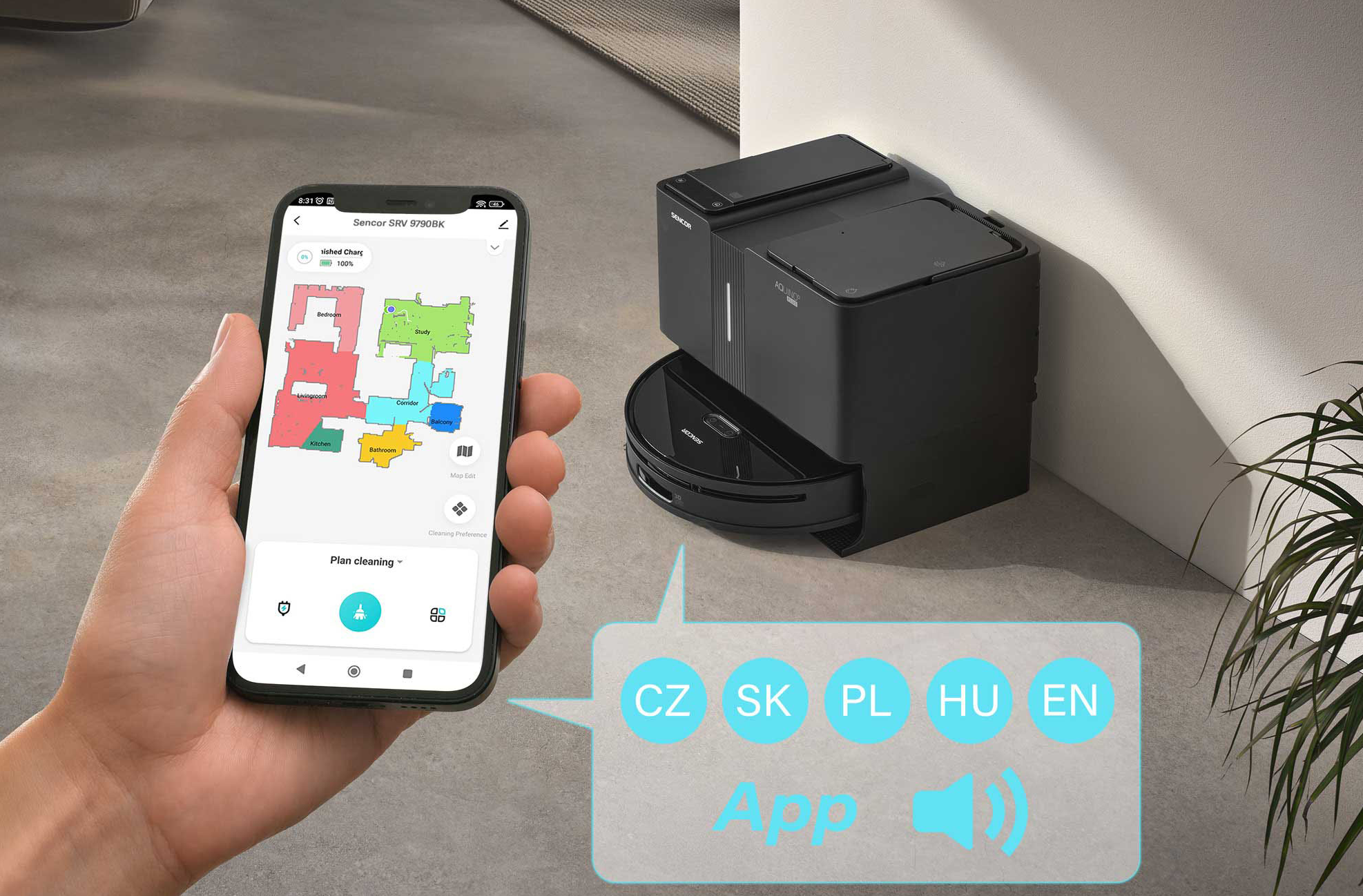Egy személy telefont használ a robot porszívó vezérléséhez. Megmutatja a ház térképét.