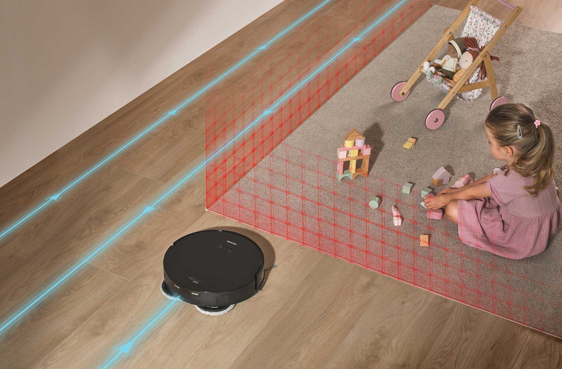 Robot porszívó fapadlón. Gyerek és baba a szőnyegen. Kék vonalak a tisztítási útvonalat mutatják.