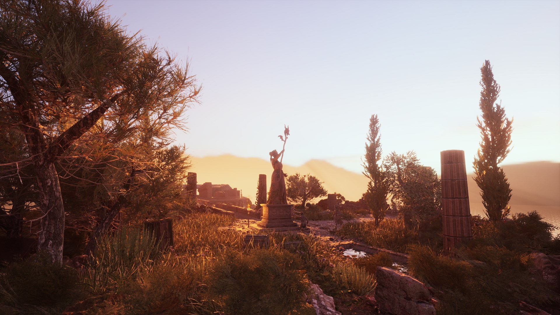 Coucher de soleil sur paysage avec statue, arbres et ruines antiques.