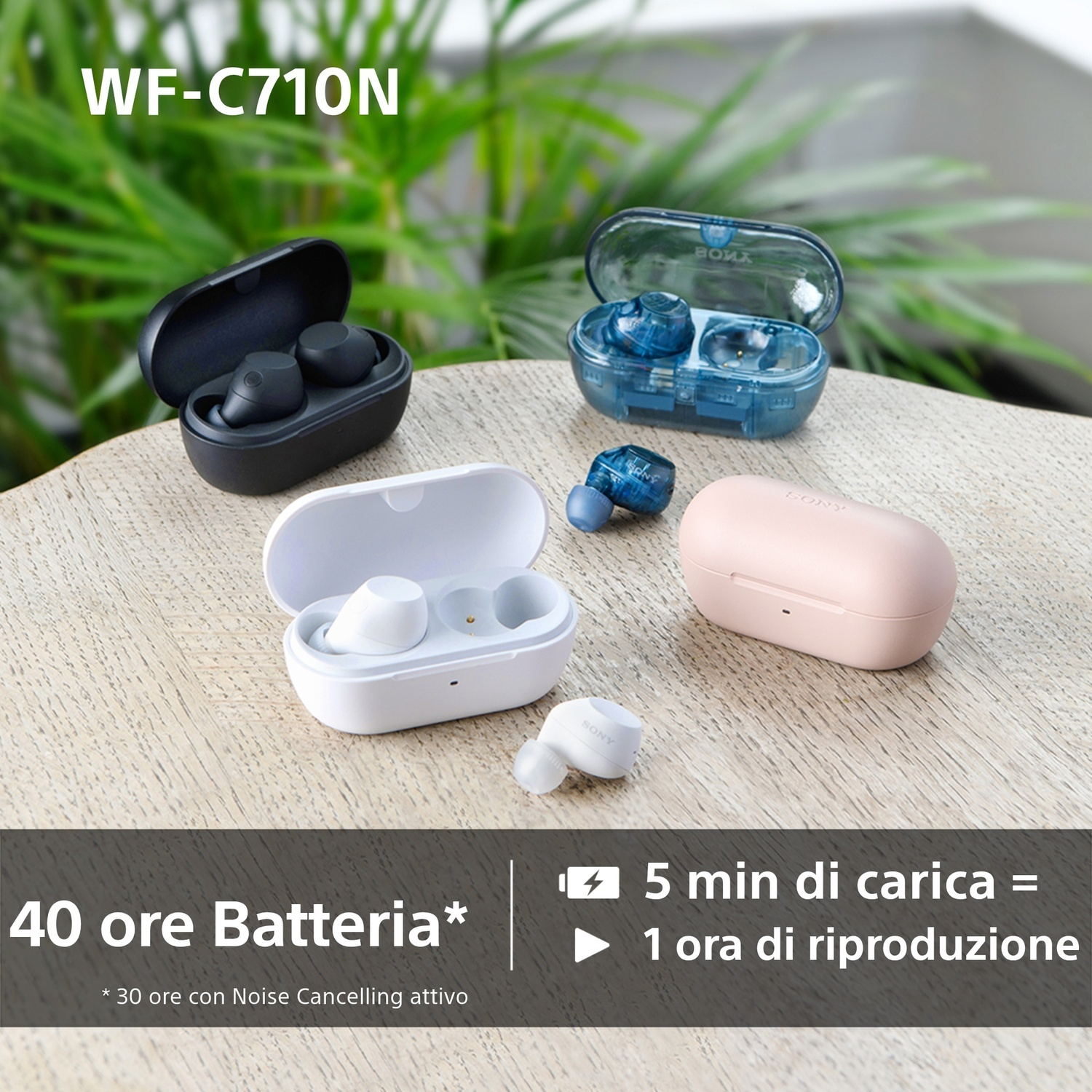Auricolari in diversi colori, disposti su un tavolo, insieme a una custodia di ricarica.