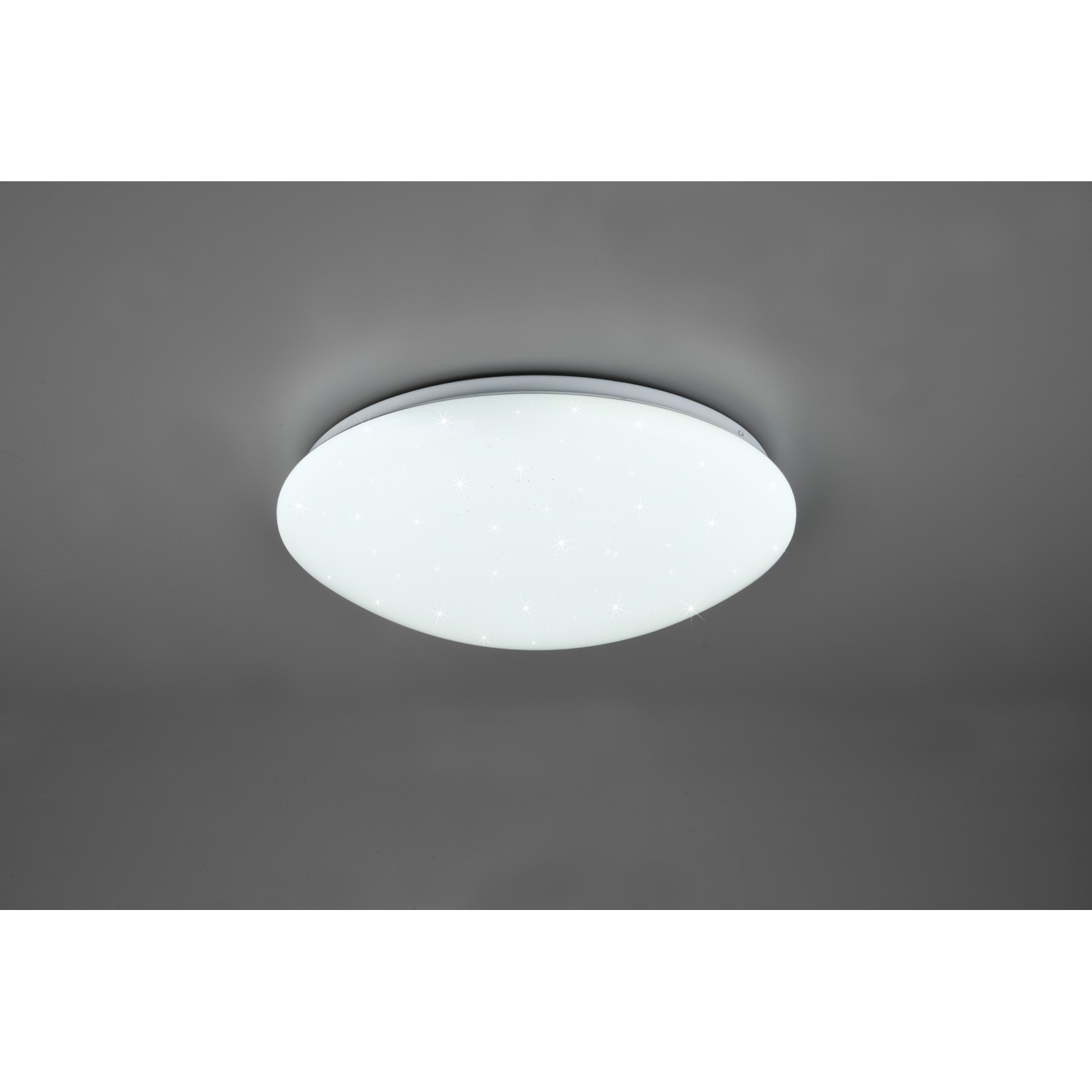Una luce da soffitto ovale bianca con un design a stella, montata su un soffitto grigio.