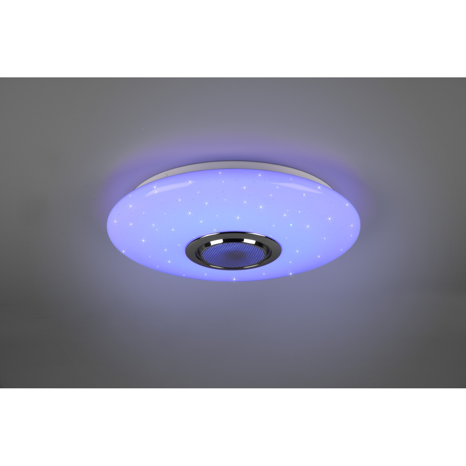 Un apparecchio di illuminazione a soffitto rotondo con un design stellato blu e bianco e un altoparlante metallico centrale.