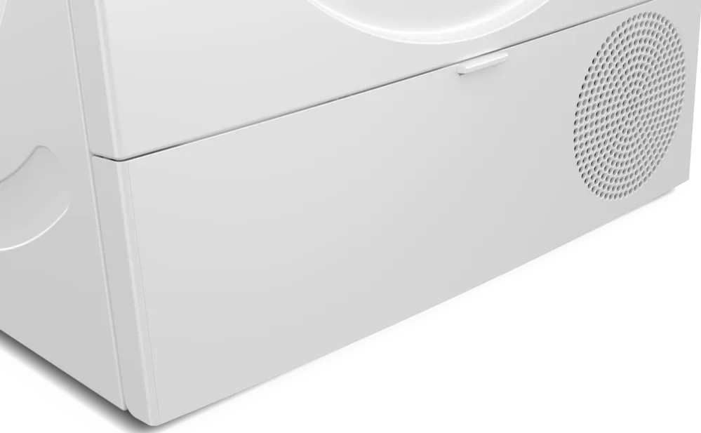 Zbliżenie białego urządzenia. Obraz przedstawia białą, czystą powierzchnię z okrągłym otworem wentylacyjnym.
