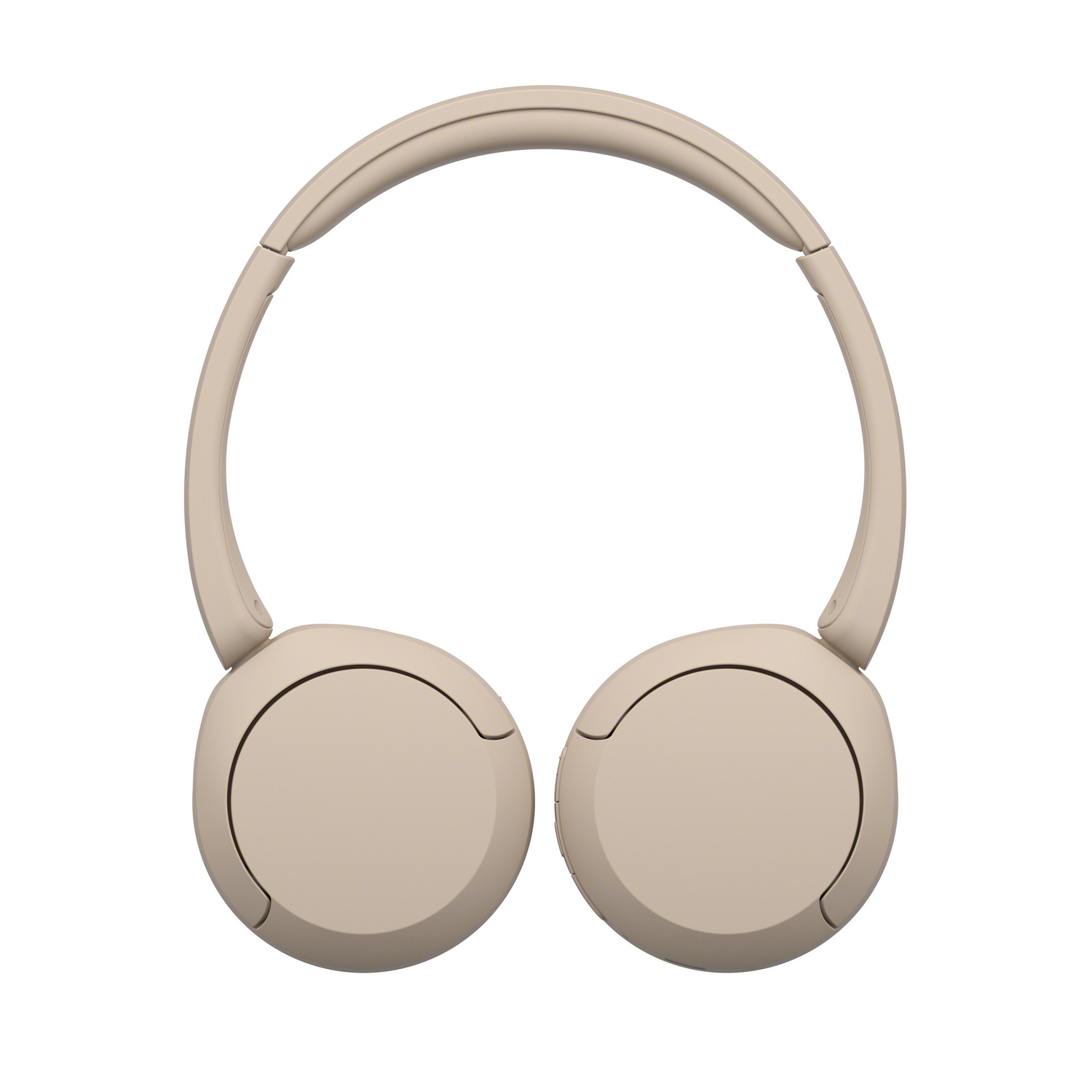 Un par de auriculares beige con un diseño circular, vistos desde arriba.