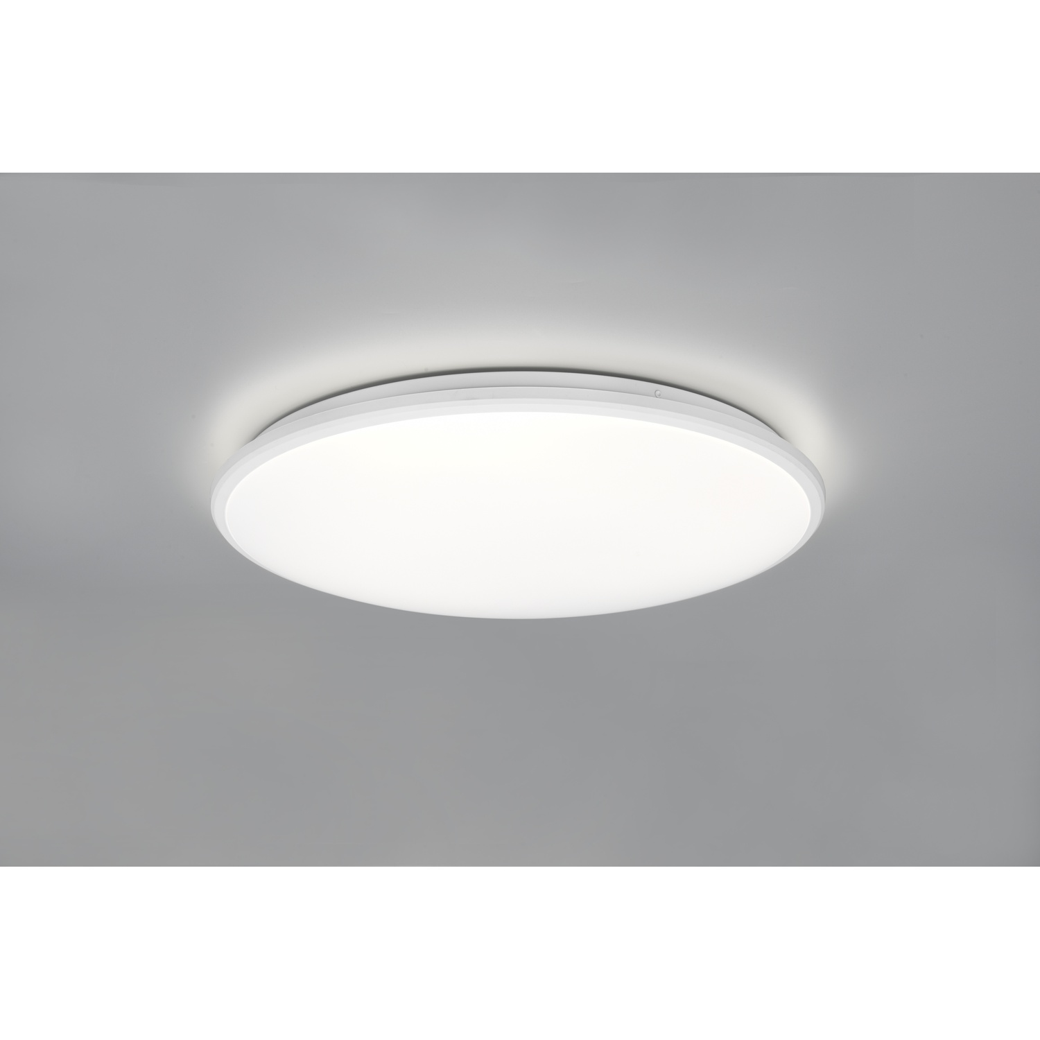 Una luce da soffitto circolare bianca su sfondo grigio.