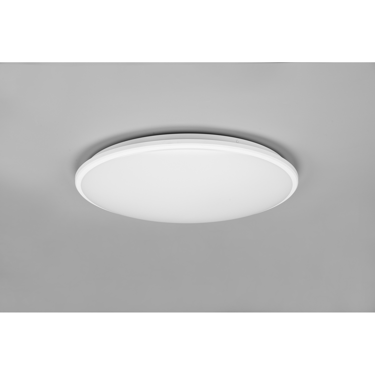 Luce da soffitto bianca, circolare, design semplice, montata su un soffitto grigio.