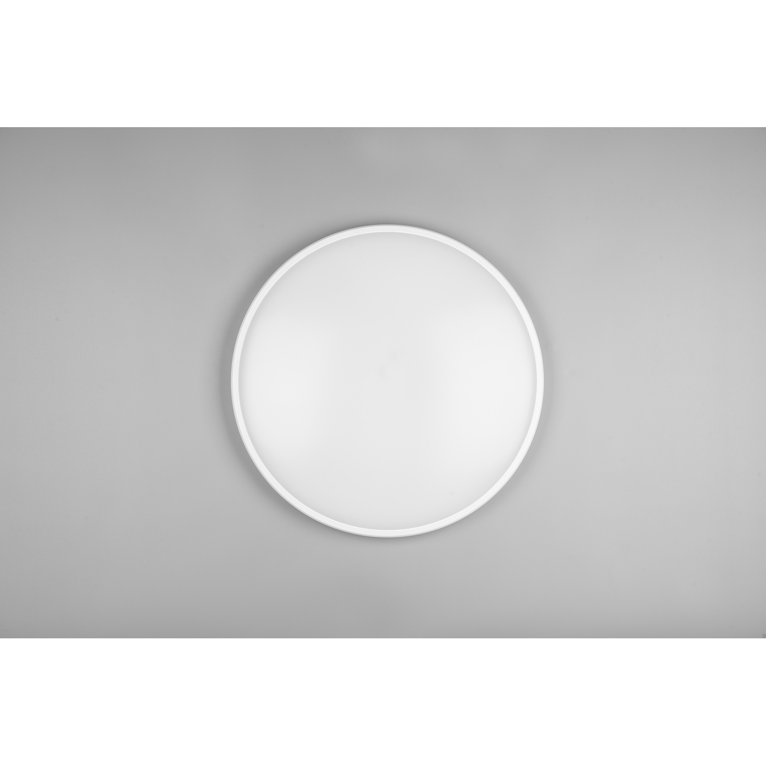Un lampadario circolare bianco su sfondo grigio.