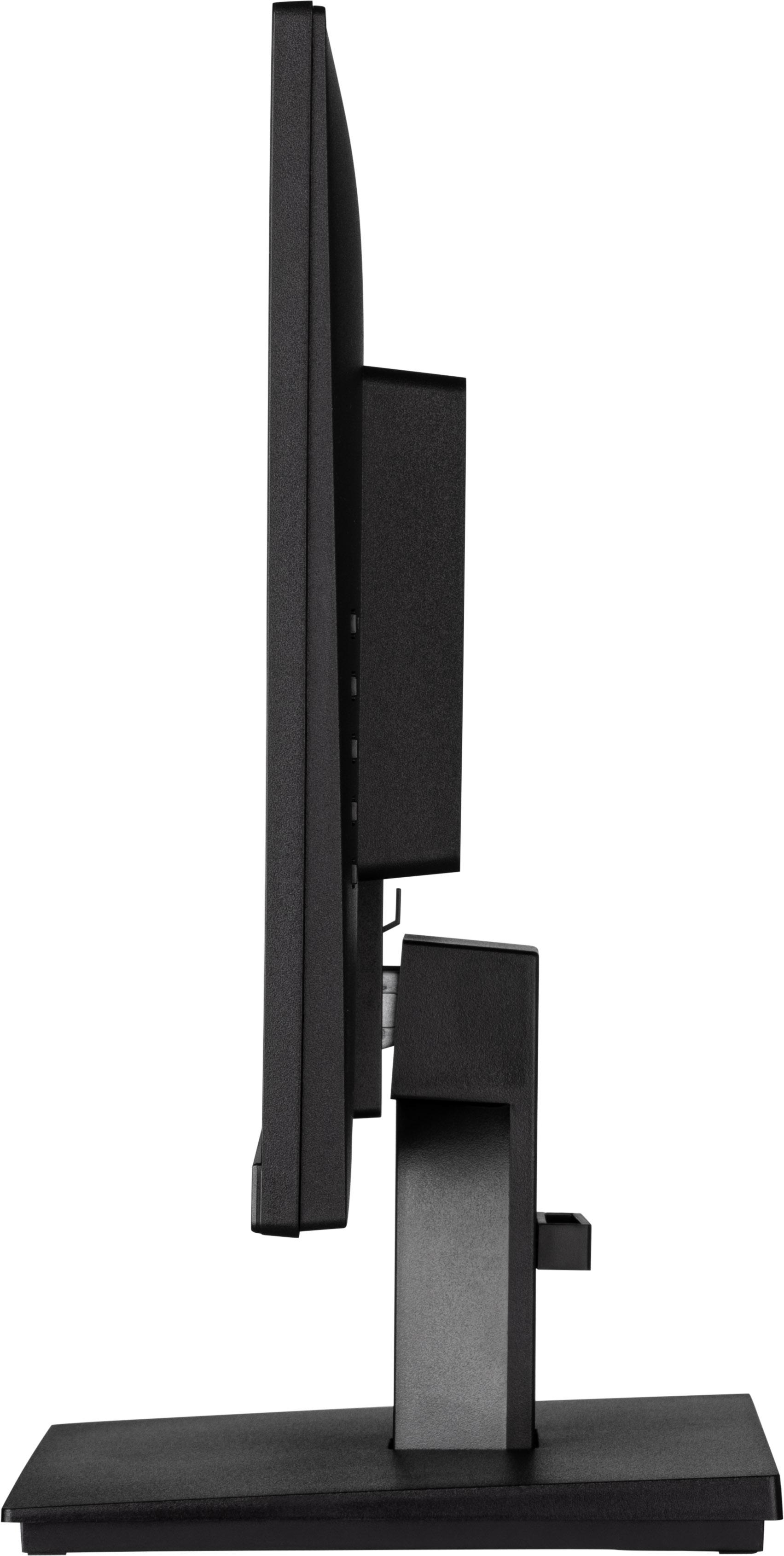 Seitenansicht eines schwarzen Computermonitors auf einem schwarzen Ständer auf grauer Oberfläche.
