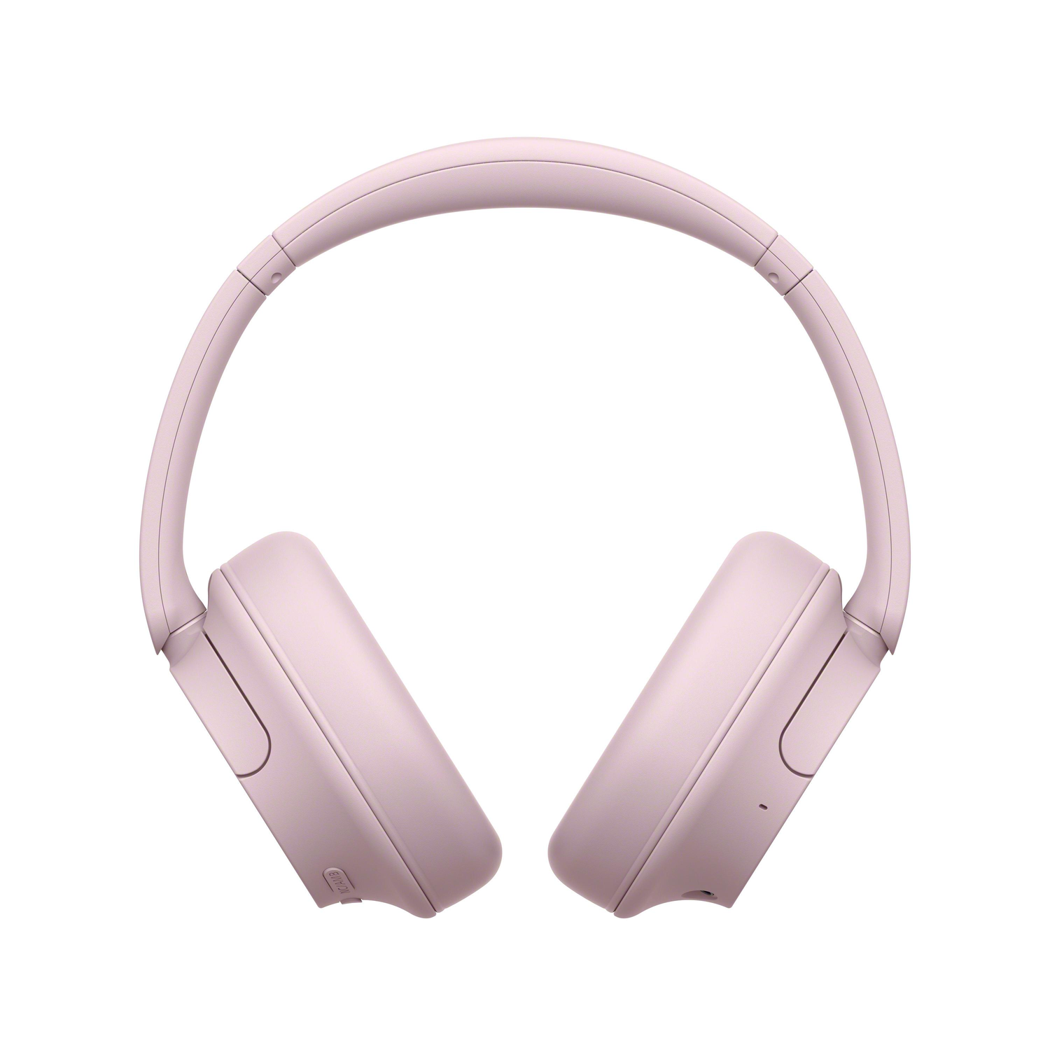 Pair of light pink over-ear headphones, angled slightly. The earcups are round.